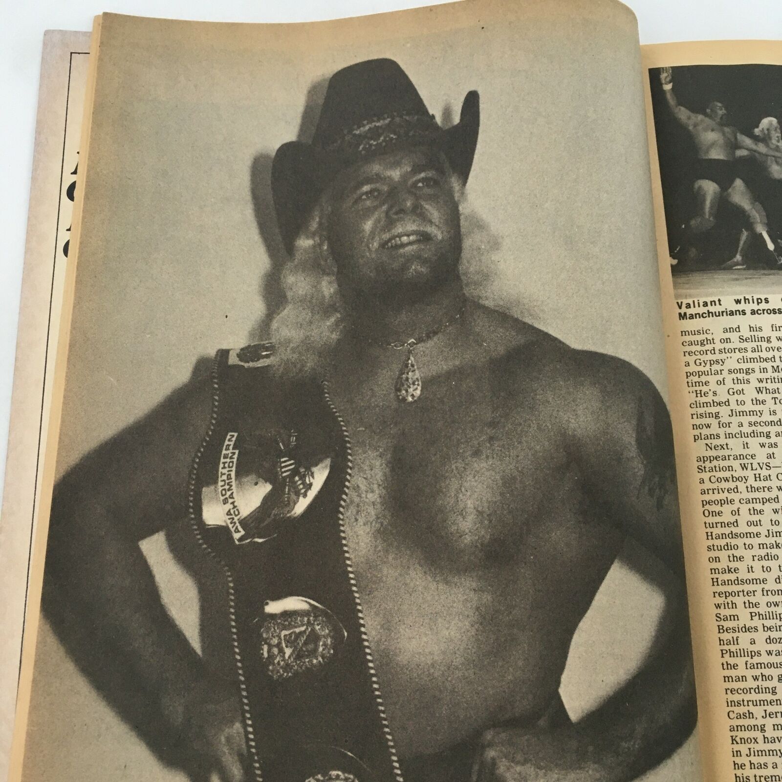 Black and white photo of a wrestler wearing a championship belt from The Ring's Wrestling Magazine February 1981.