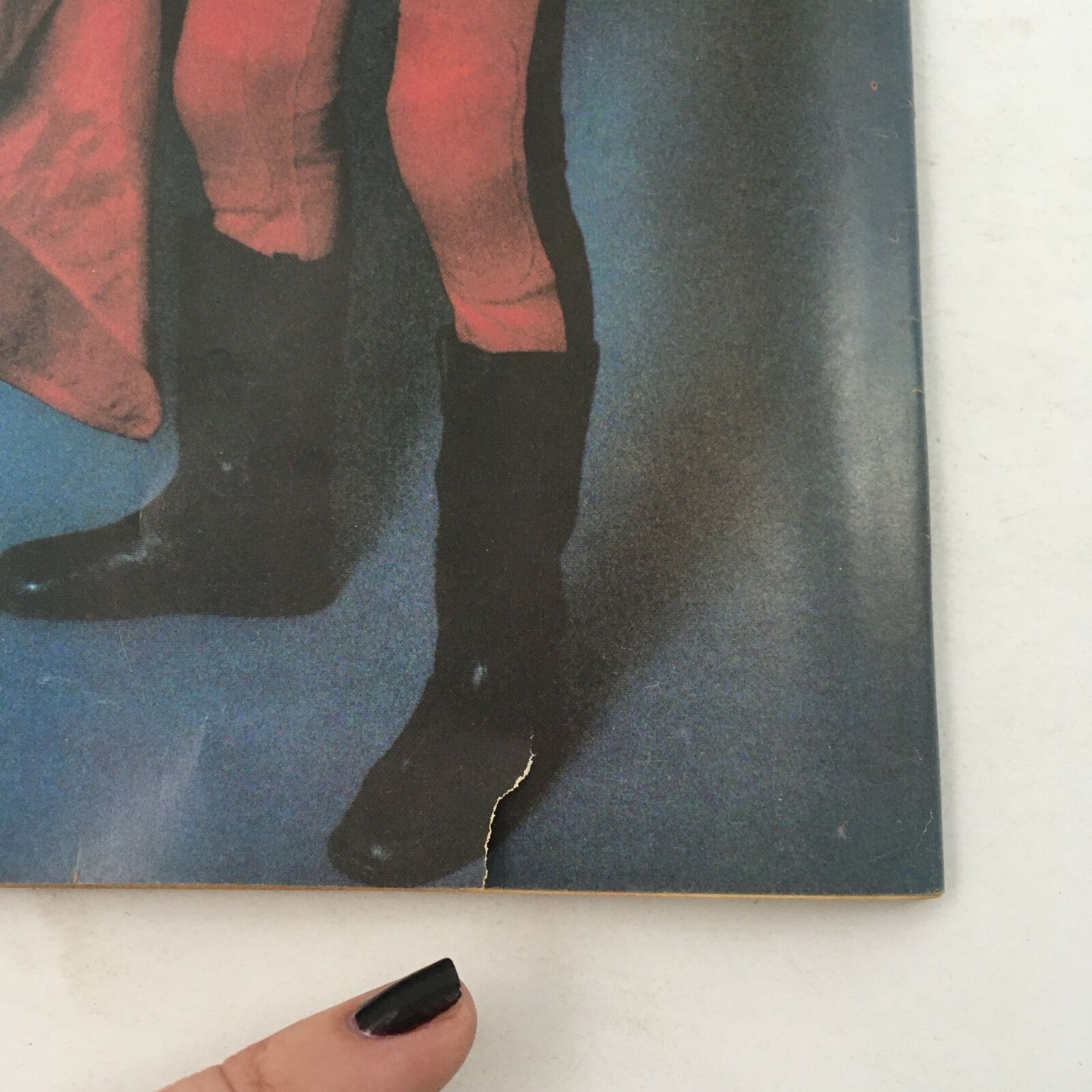 Detail of The Ring's Wrestling Magazine February 1981 featuring a close-up view of page showcasing wrestlers in boots, emphasizing the vintage style and historical significance of this collectible magazine.