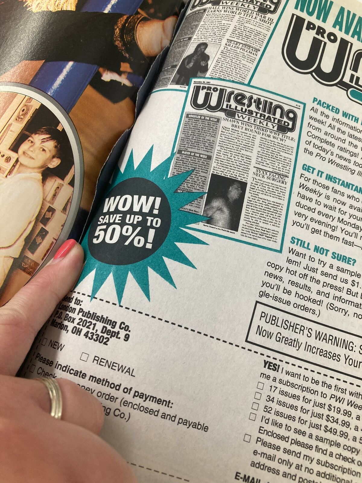 A vintage magazine page from 'The Wrestler Presents Summer 1998' showing an advertisement for Pro Wrestling Illustrated with a bold 'WOW! SAVE UP TO 50%' banner. The page features a background of wrestling images, capturing the essence of 90s wrestling nostalgia.