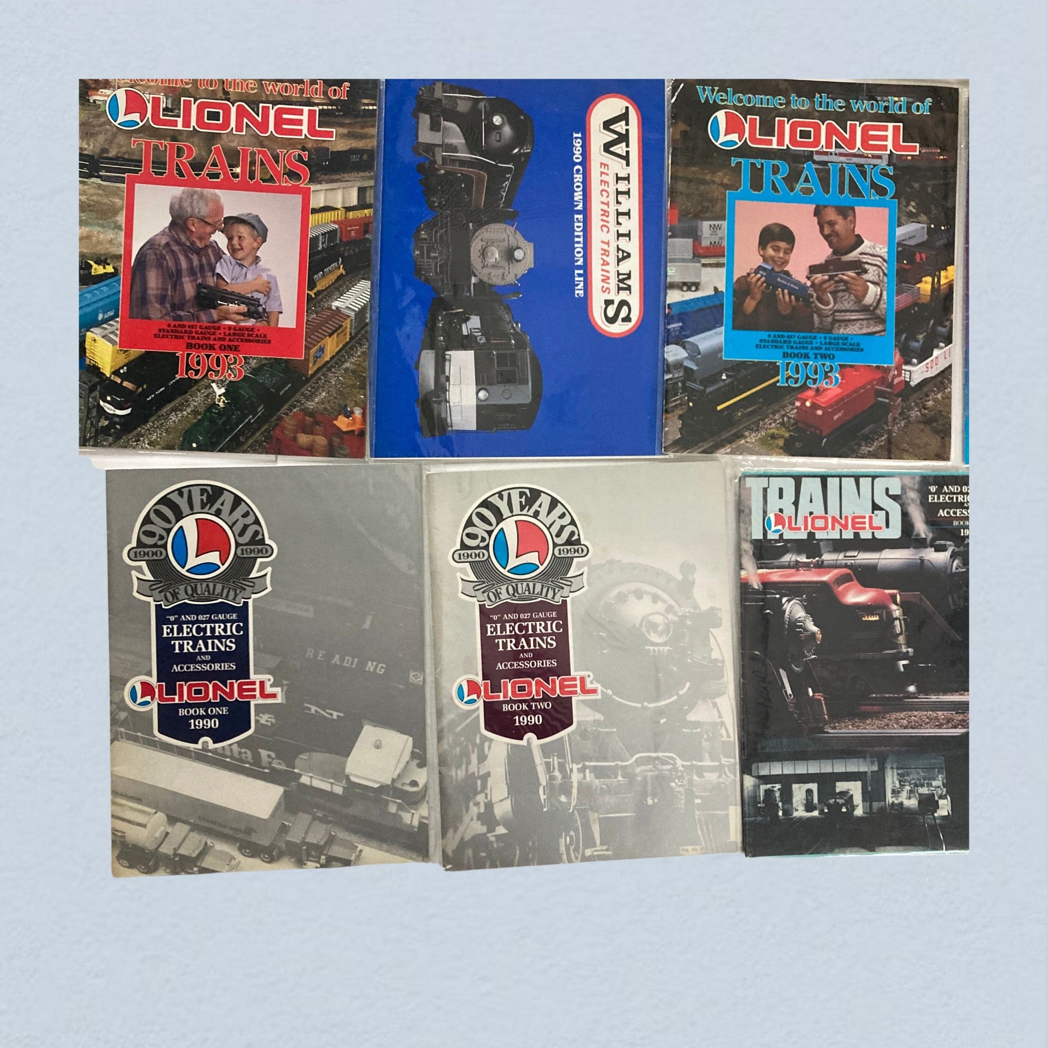 Lot of 24 1990s Lionel Electric Trains and Accessories Catalog, including detailed covers of Lionel trains catalogs from 1990, highlighting train models, accessories, and promotional content.