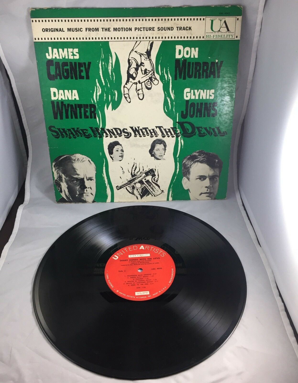 Shake Hands With the Devil original Soundtrack LP from United Artists, featuring artwork of the film and prominent actors James Cagney, Dana Wynter, Don Murray, and Glynis Johns.