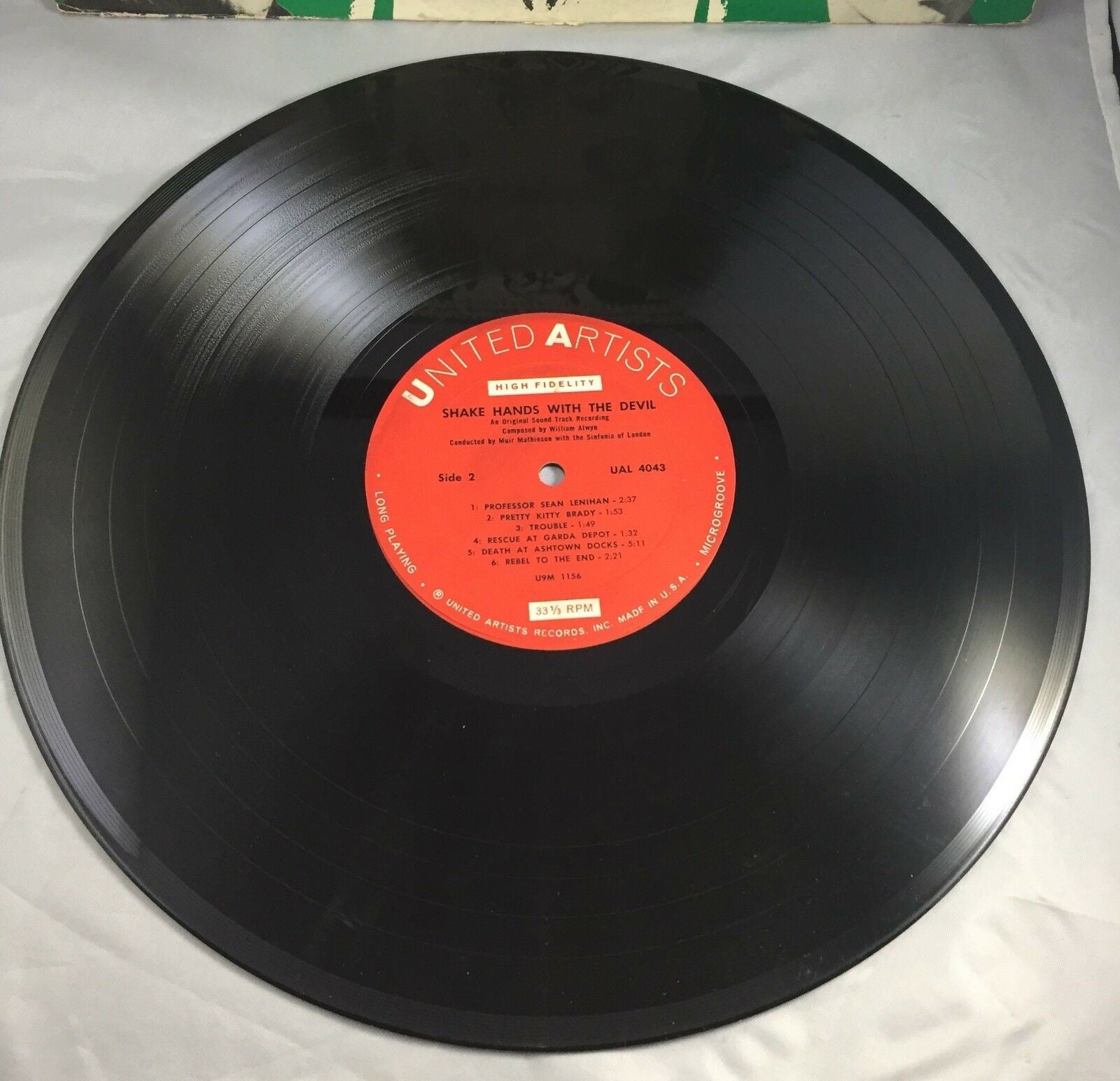 Detailed view of the Shake Hands With the Devil original Soundtrack LP vinyl record surface, illustrating its condition and playability.