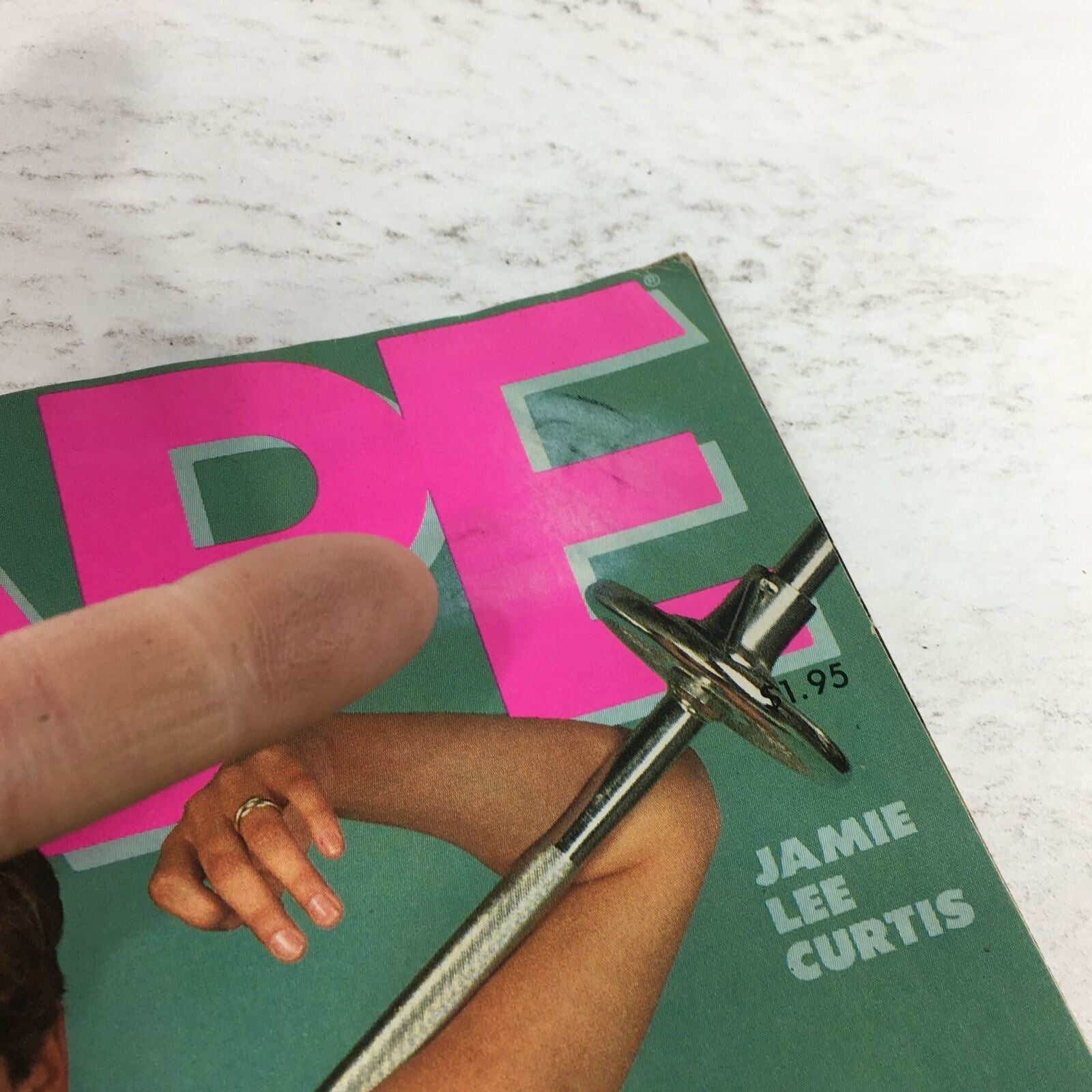 Close-up of the cover of VTG Joe Weider's Shape Magazine: February 1984, highlighting Jamie Lee Curtis and details of the magazine's design elements.
