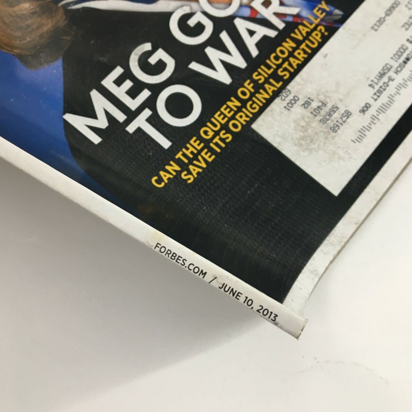 Side view of the Forbes Magazine June 10 2013 showcasing the date and logo with some wear at the edge of the magazine.