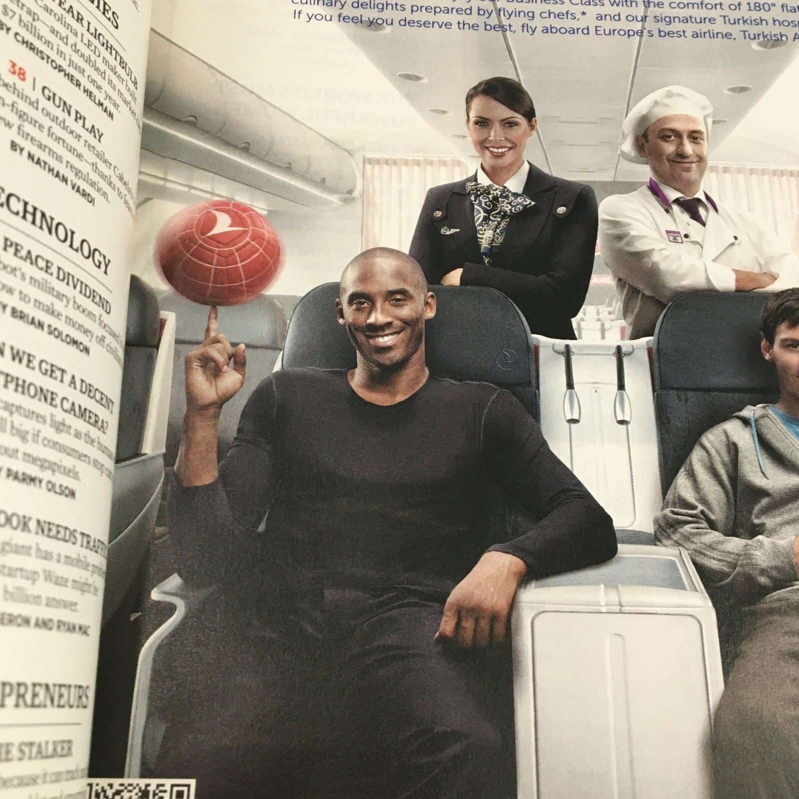 A closer look at an advertisement in Forbes Magazine June 10 2013 for Turkish Airlines, showing a male passenger happily balancing a globe on his finger.