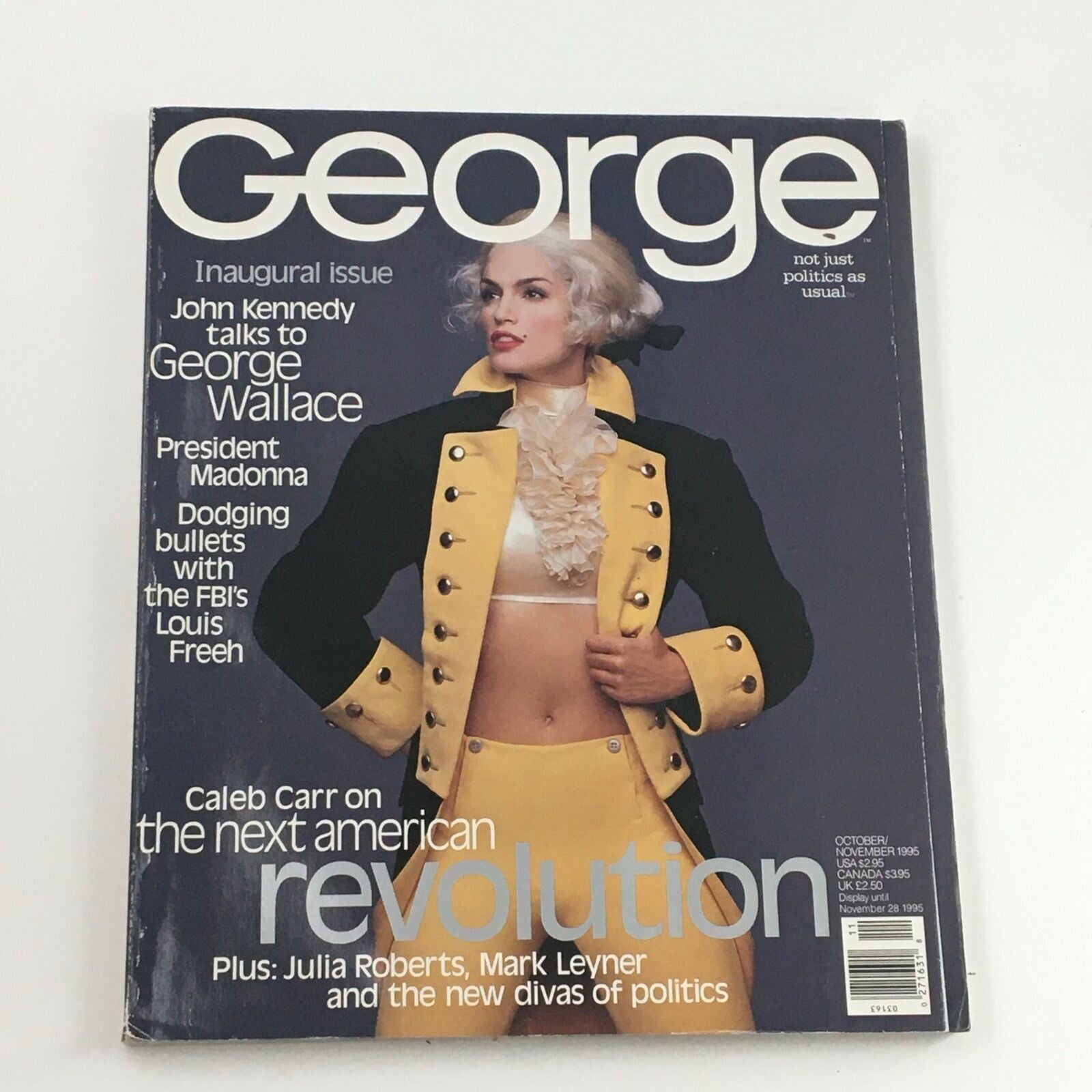 Cover of George Magazine, October 1995, featuring a cover story with John Kennedy talking to George Wallace and a striking model in a historical costume. Highlights include Madonna, Caleb Carr, and discussions on American politics.