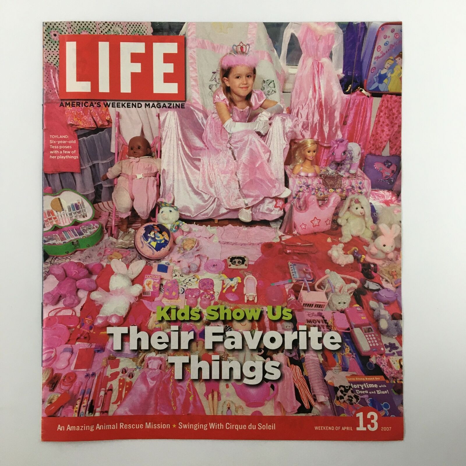 Life Magazine Newspaper Insert Tess & Her Playthings April 13 2007 featuring a young girl surrounded by colorful toys and a playful setting, showcasing a nostalgic moment from the magazine's history.