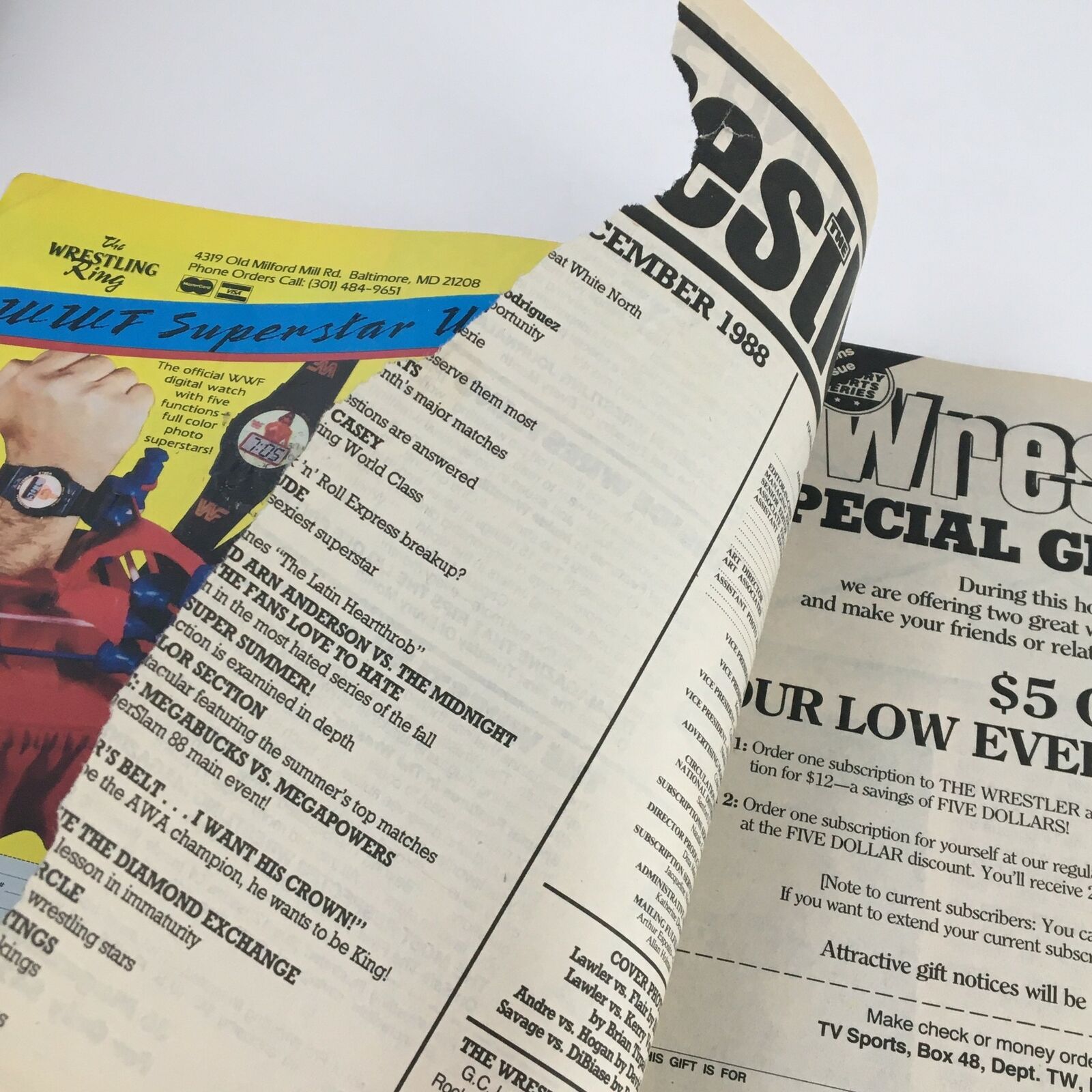 Inside page of The Wrestler, December 1988, displaying the magazine's layout featuring wrestling events and advertisements. Andre The Giant vs Hulk Hogan cover story highlighted.