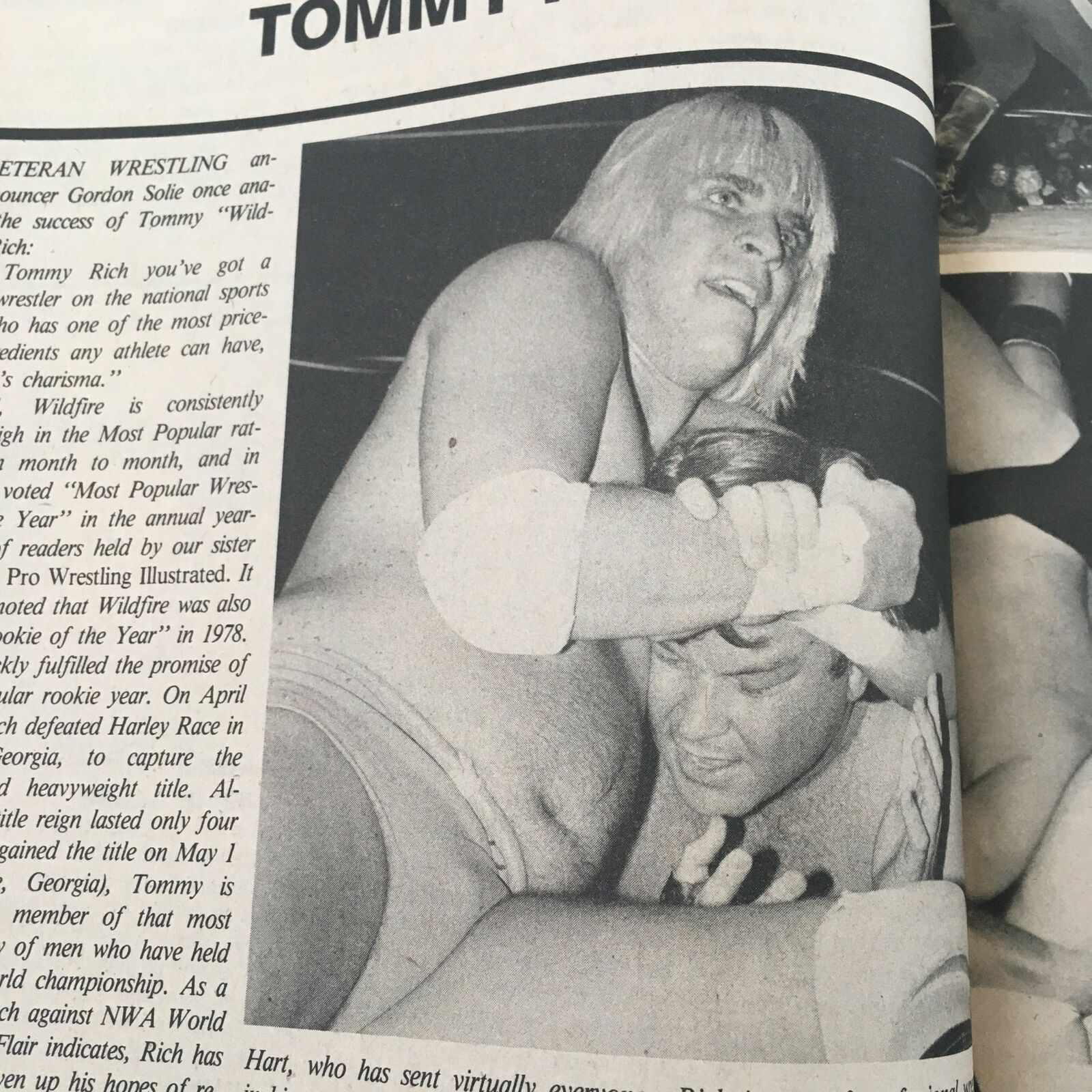 Black and white action photo in The Wrestler Magazine May 1985 featuring Tommy Rich in a wrestling match, showcasing wrestling skills and athleticism.
