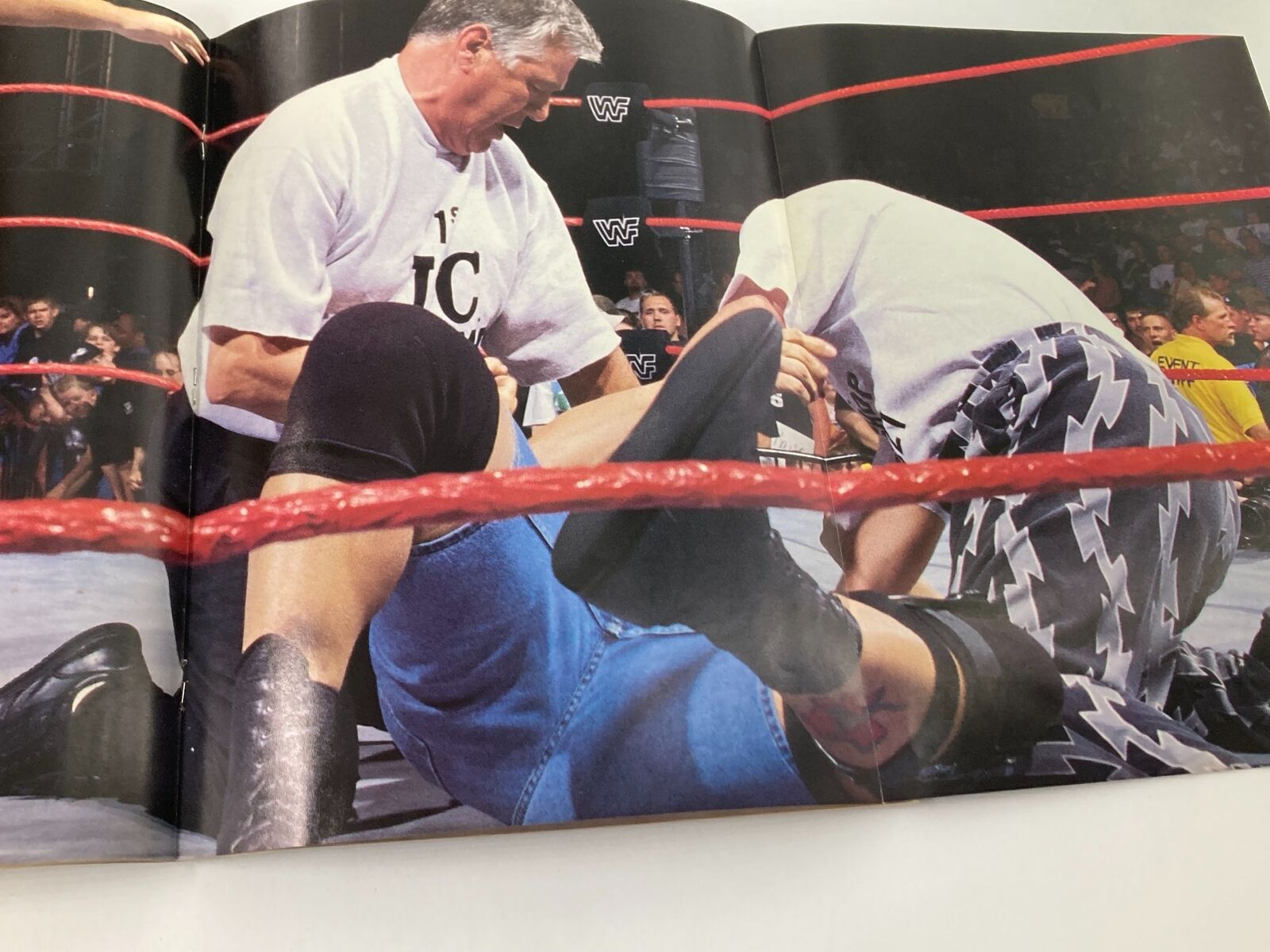WWF Raw Magazine August 1998 features an intense wrestling scene with participants in action inside the ring, showcasing the thrilling atmosphere of professional wrestling, including elements relevant to Stone Cold Steve Austin and Vince McMahon.