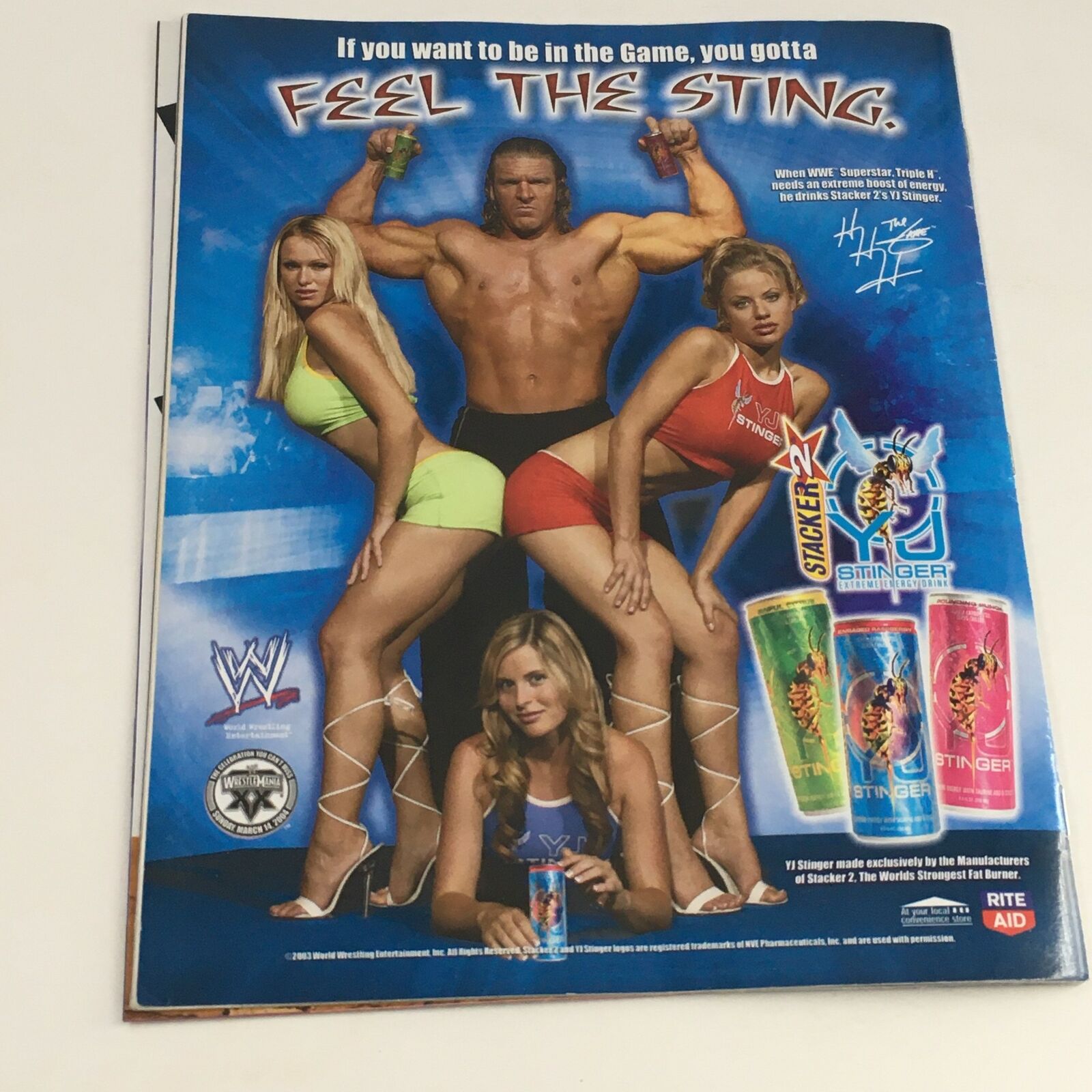 Back cover of WWE Raw Magazine November 2003 advertising WWE merchandise, featuring wrestlers and promoting the gaming experience.