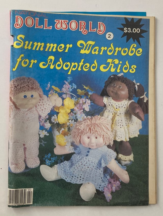 Cover of VTG Doll World Magazine 1985 #2 titled 'Summer Wardrobe for Adopted Kids,' featuring colorful handmade dolls against a vibrant blue background.