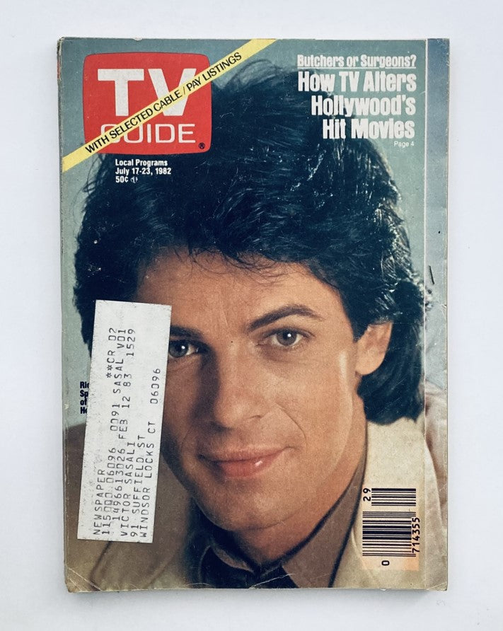 Cover of TV Guide Magazine from July 17, 1982 featuring Rick Springfield. The magazine discusses how TV alters Hollywood's hit movies, showcasing the star's popularity during that time.