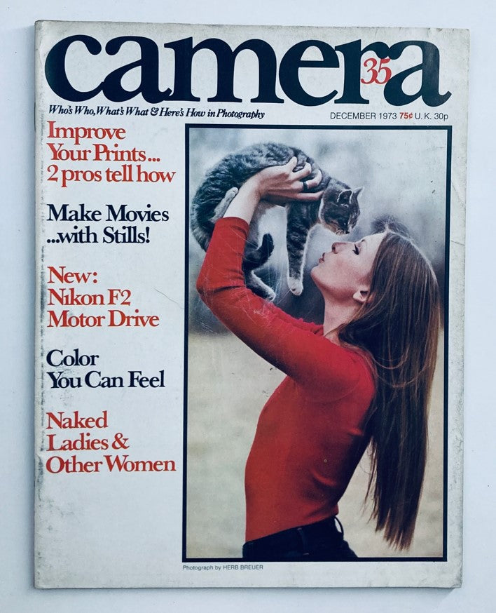 Camera 35 Magazine December 1973 Vol 17 No. 9 featuring a woman kissing a cat, highlighting the theme 'Make Movies with Stills' and showcasing vintage photography.