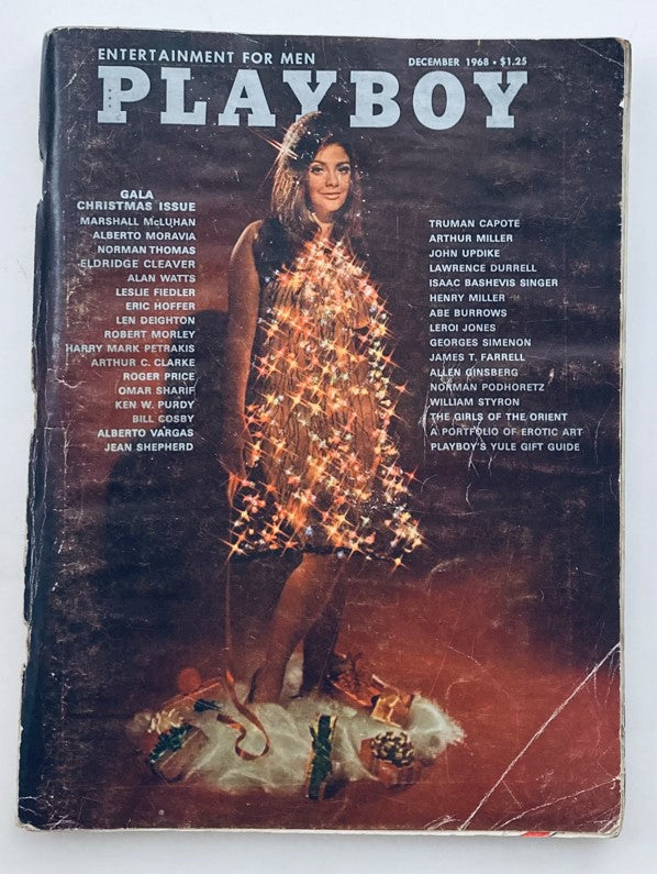 Cover of VTG Playboy Magazine December 1968 featuring a model in festive attire with Christmas lights, showcasing the issue's theme and Playmate Cynthia Myers.