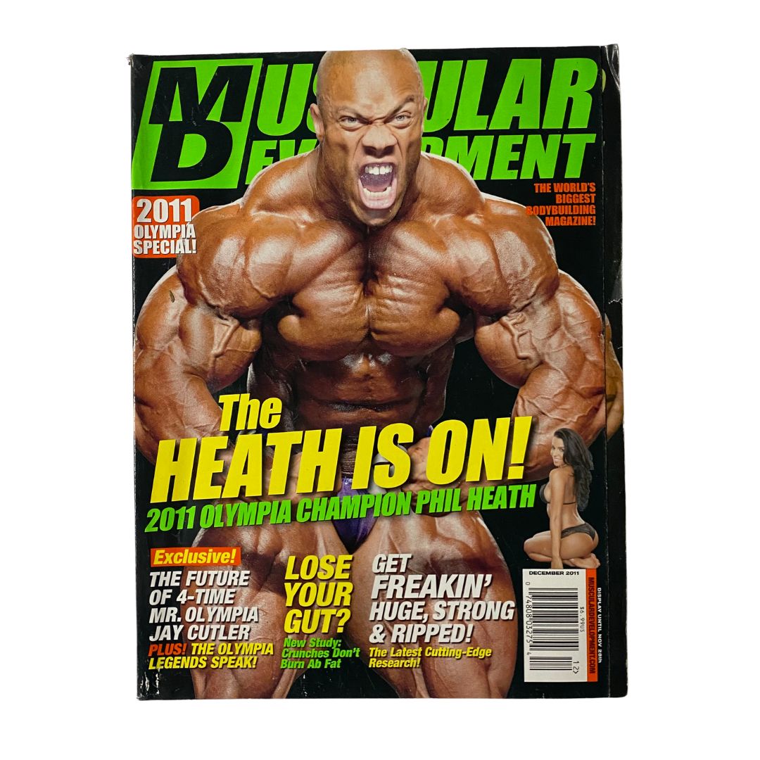 Muscular Development Magazine December 2011 featuring Phil Heath on the cover in a powerful pose, celebrating his achievements as a bodybuilding champion and Mr. Olympia.