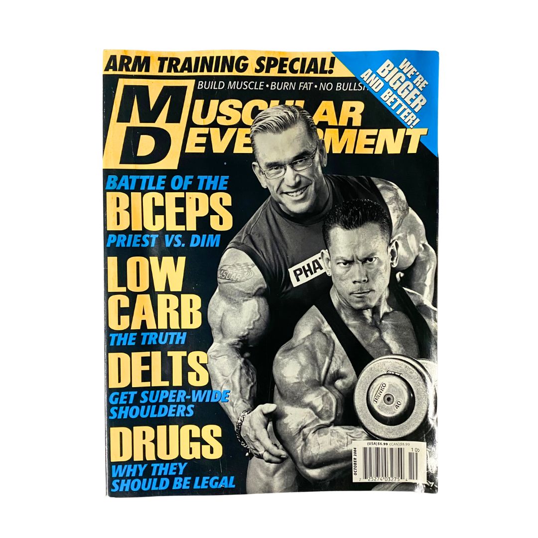 Muscular Development Magazine October 2004 featuring Lee Priest and Kris Dim on the cover. Highlights include arm training special and articles on biceps, low carb diets, and delts for broad shoulders.