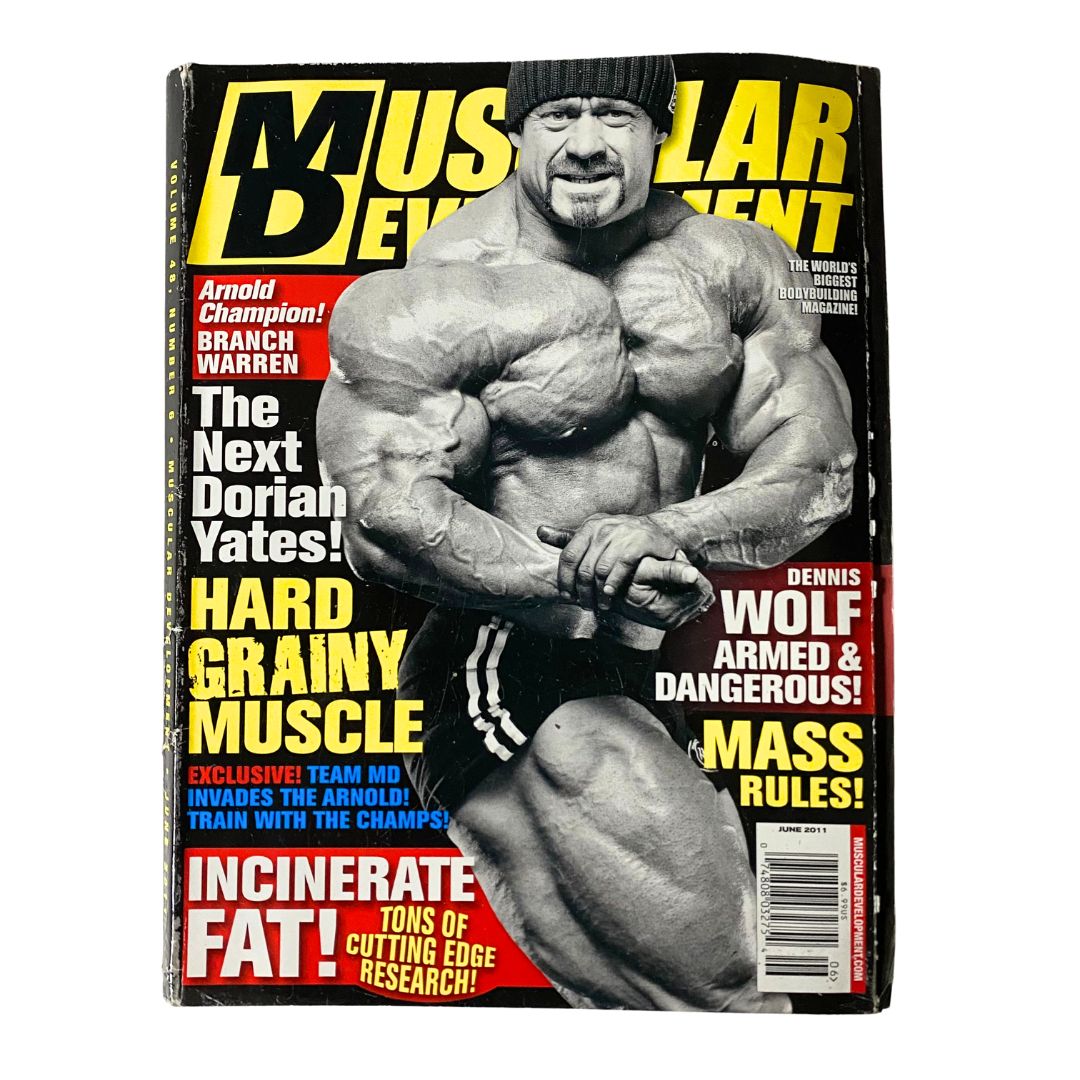 Muscular Development Magazine June 2011 featuring Dennis Wolf on the cover, showcasing his strong physique and emphasizing topics like hard grainy muscle and Arnold's champion legacy.