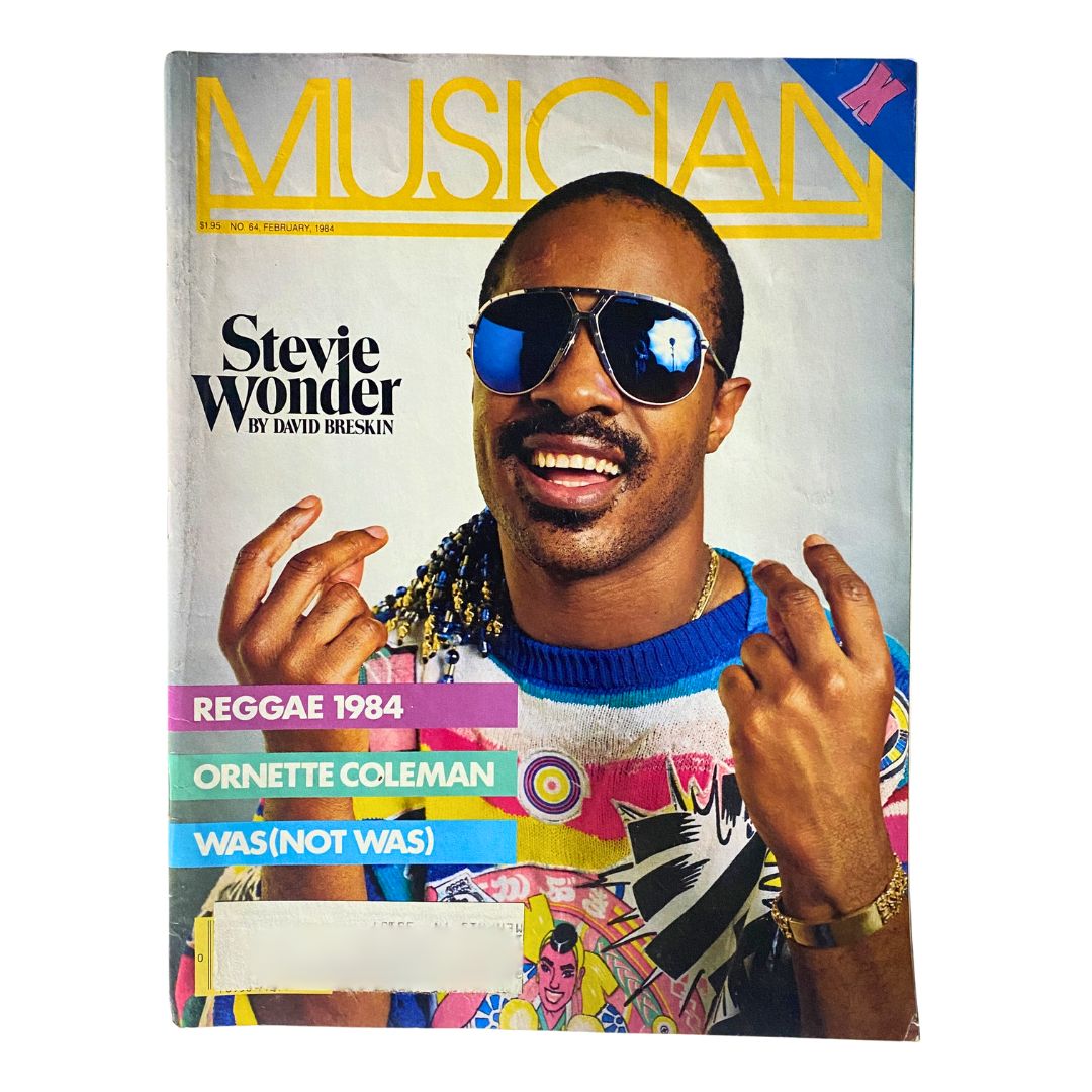 Cover of VTG Musician Magazine February 1984 featuring Stevie Wonder by David Breskin, showcasing a portrait of Stevie Wonder wearing sunglasses and a colorful sweater, highlighting the vibrant 1980s music culture.