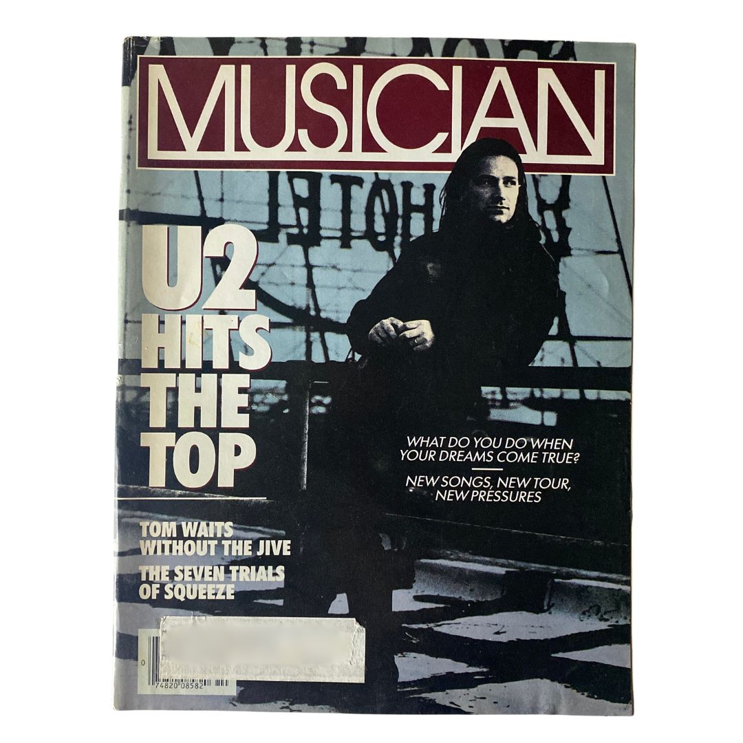 Musician Magazine October 1987 featuring Bono from U2 on the cover with the title 'U2 Hits The Top', highlighting the band's rise to fame in the music industry.