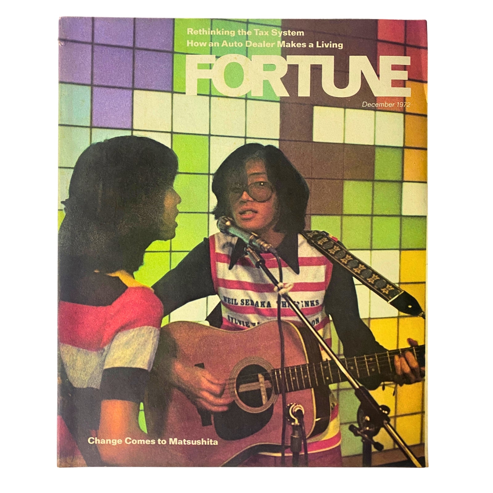Fortune Magazine December 1972 cover featuring the article 'Change Comes to Matsushita' with an illustration of two figures, one holding a guitar, set against a colorful background.