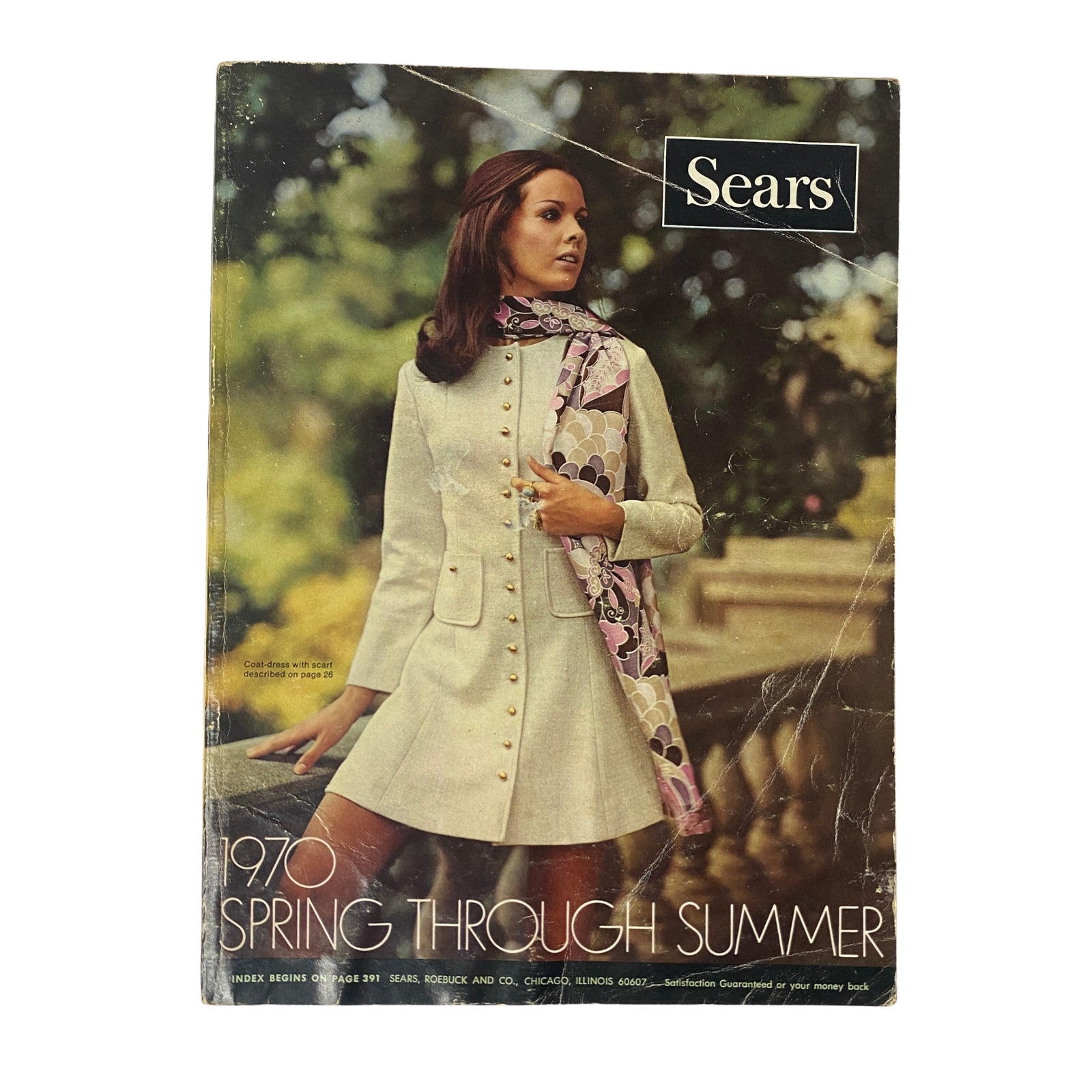 Cover of the 1970 Sears, Roebuck and Co. Spring and Summer Catalog showcasing a model in a stylish coat-dress with a scarf, embodying the fashion trends of the era and highlighting vintage 1970s home decor and clothing.