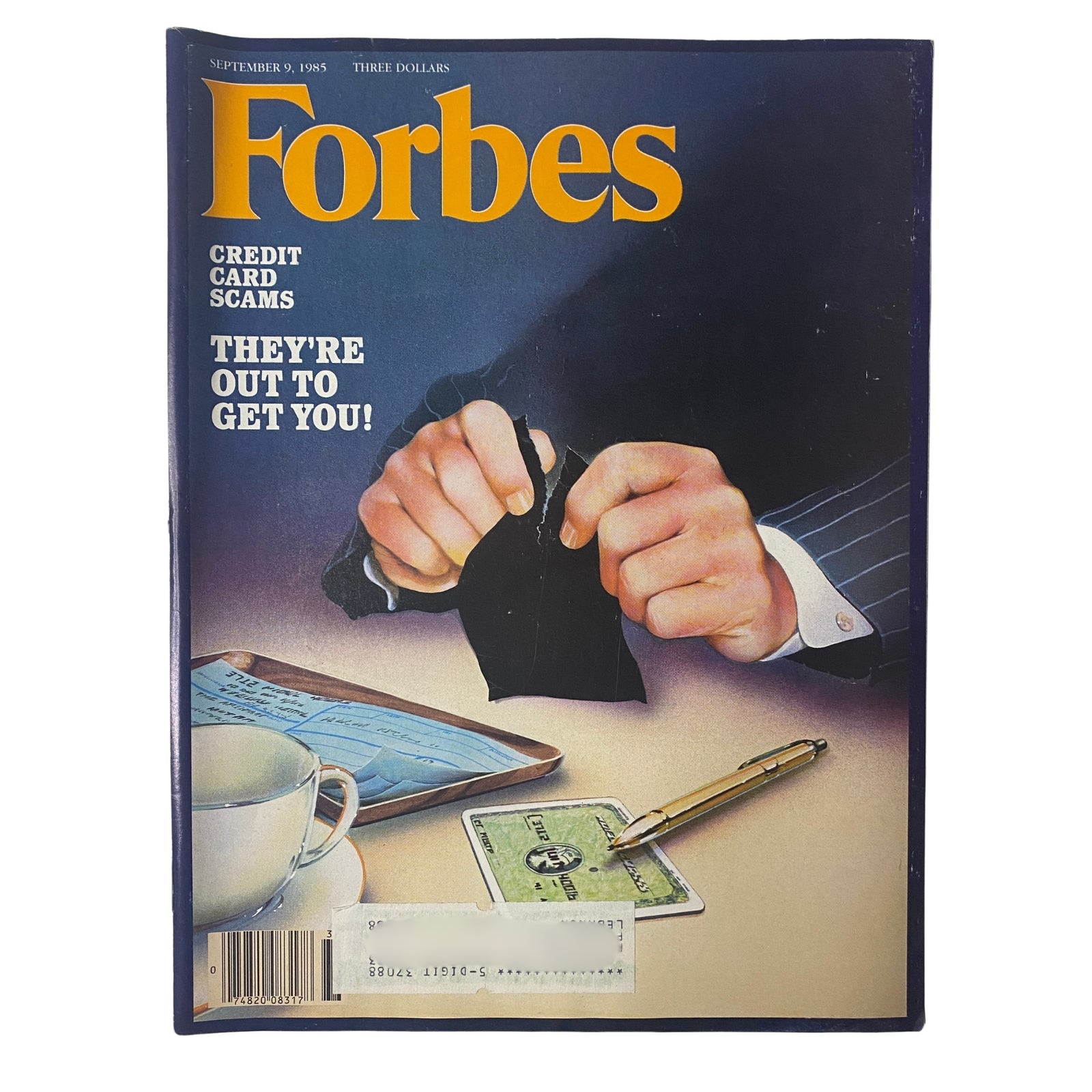 Forbes Magazine cover from September 9, 1985 featuring the title 'Credit Card Scams: They're Out To Get You!' The cover illustrates a concerned individual with hands gripping a torn credit card, symbolizing financial fraud.