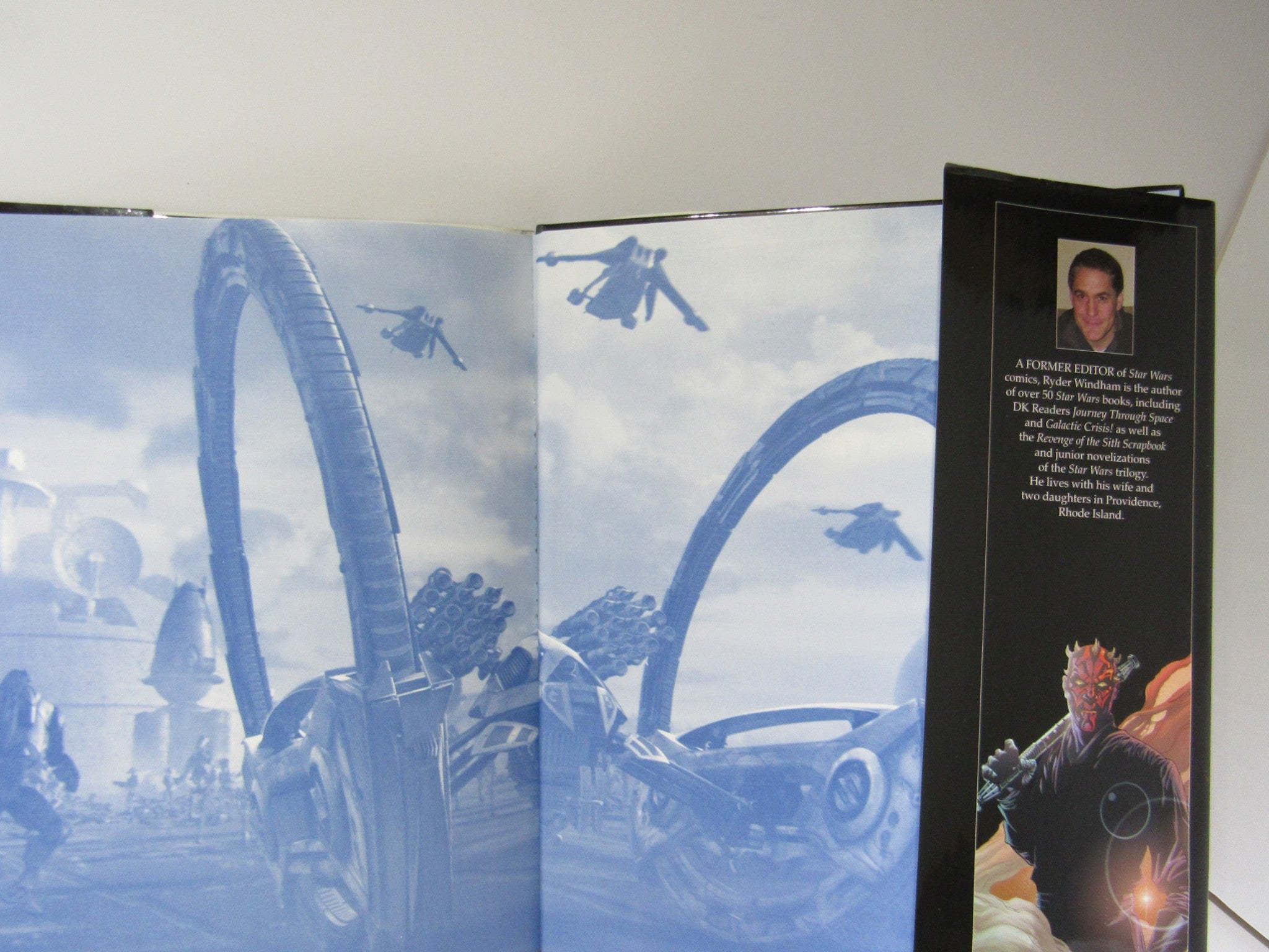 Inside view of Star Wars: The Ultimate Visual Guide highlighting the author and a prominent character with a dynamic background.