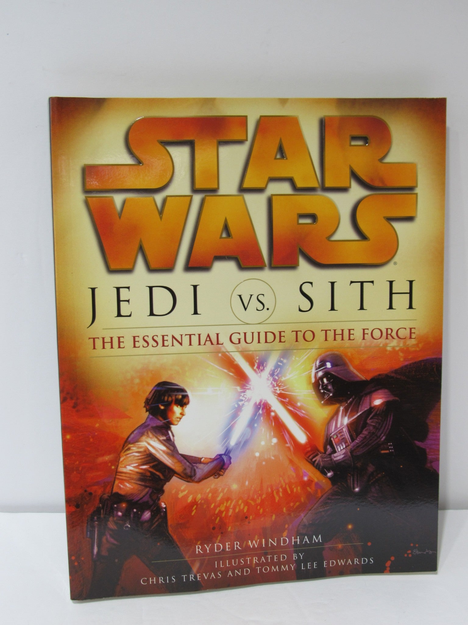 Star Wars Jedi vs. Sith: The Essential Guide to the Force book cover featuring a duel between a Jedi and a Sith.