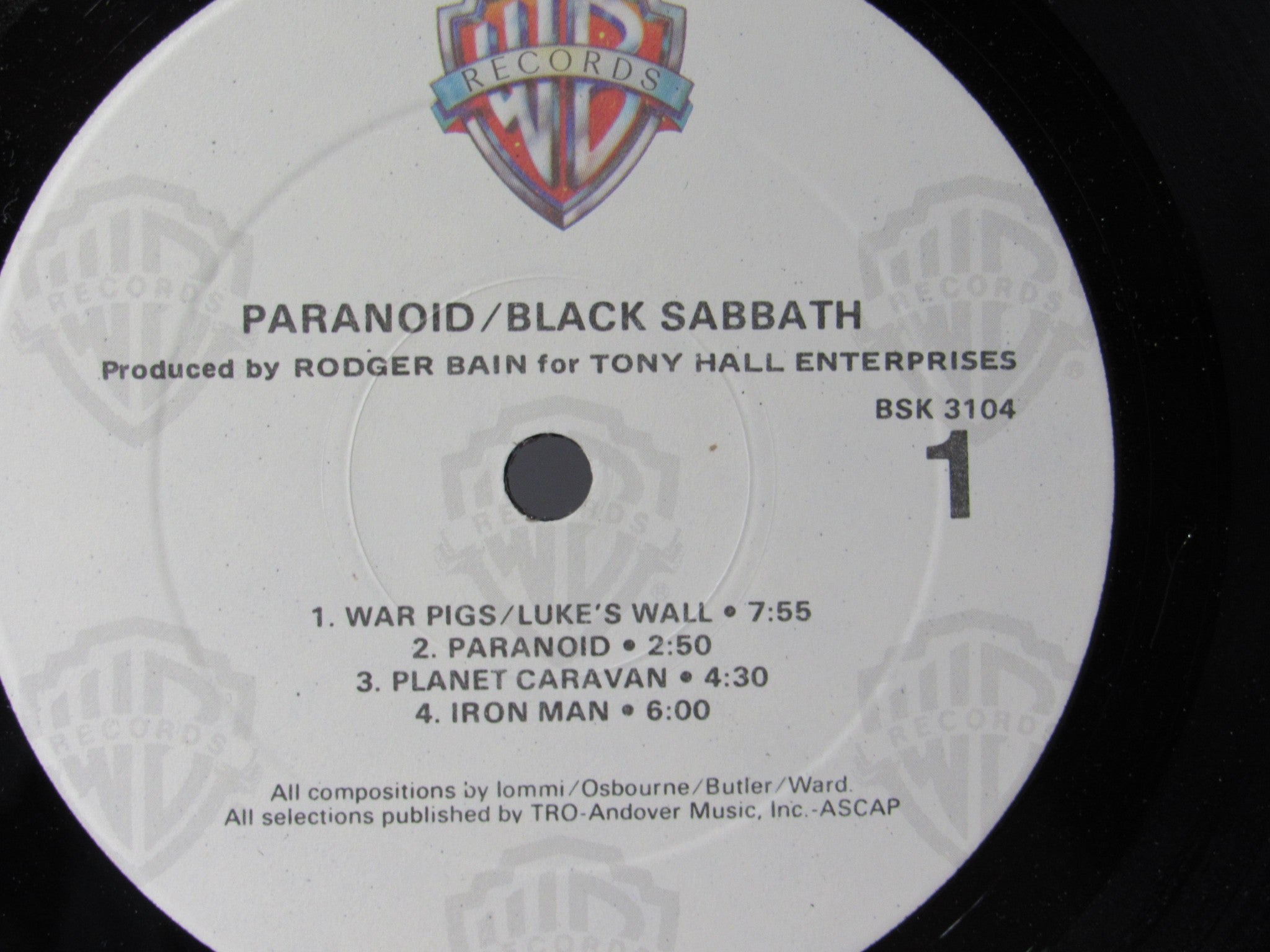 Another view of the label on the Black Sabbath Paranoid Warner Bros. Records LP BSK 3104, with detailed track listing and production credits, grade VG+