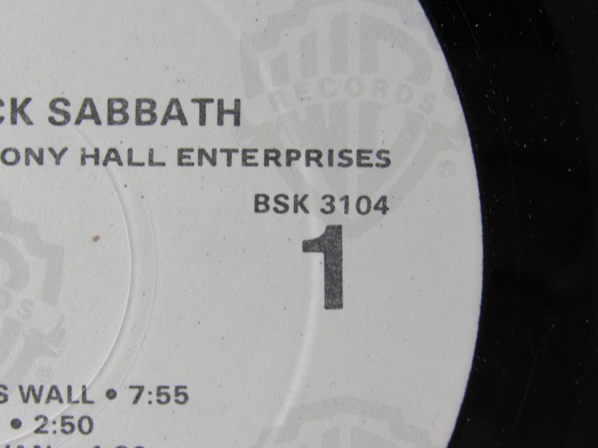 Label close-up of Black Sabbath Paranoid Warner Bros. Records LP BSK 3104, featuring track details and the record catalog number.