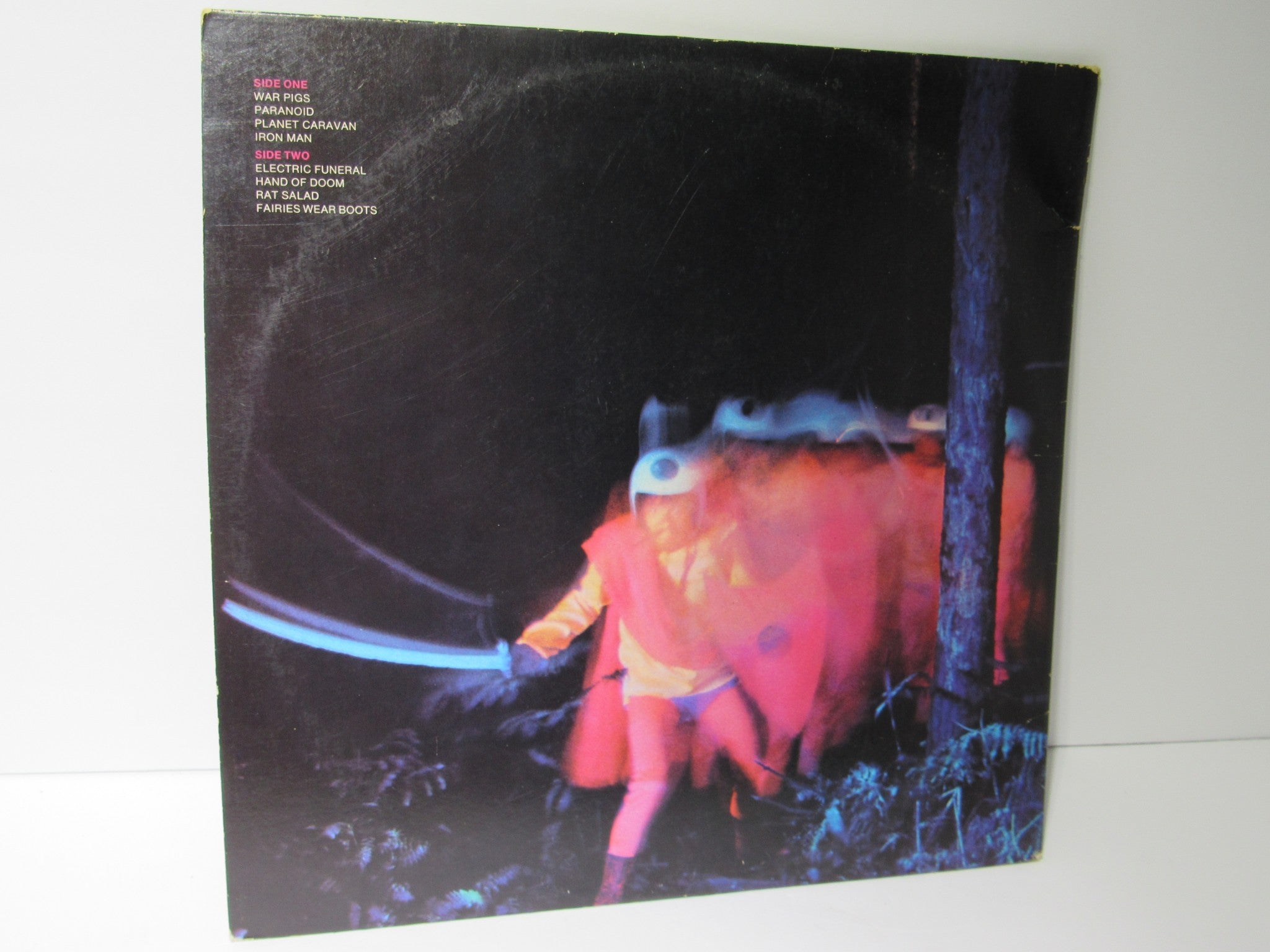 Back cover of Black Sabbath Paranoid Warner Bros. Records LP BSK 3104, featuring the album artwork and song titles.