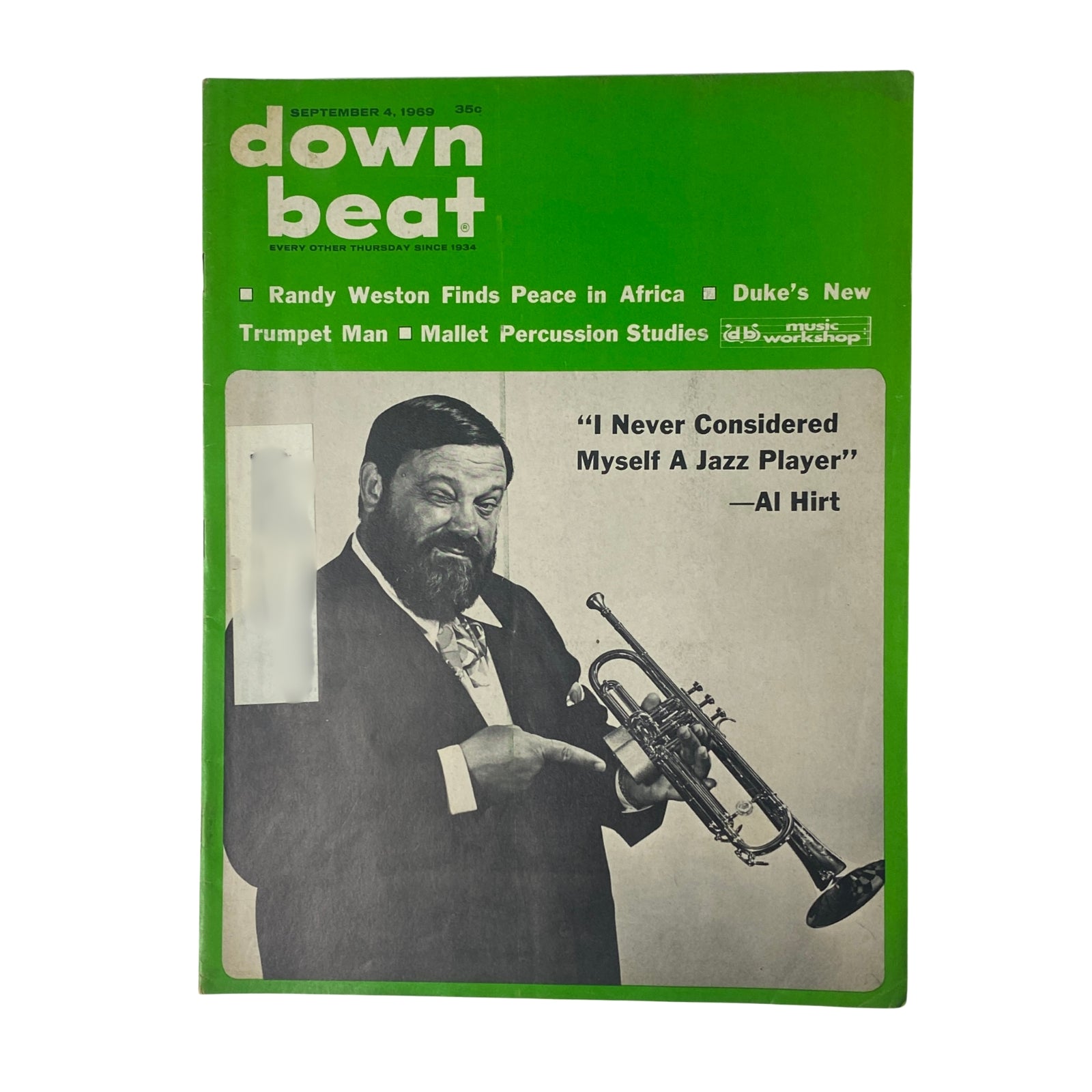Down Beat Magazine cover from September 4, 1969, featuring Al Hirt, showcasing articles about jazz including Randy Weston and Al Hirt's interview. Vintage magazine with a green theme.
