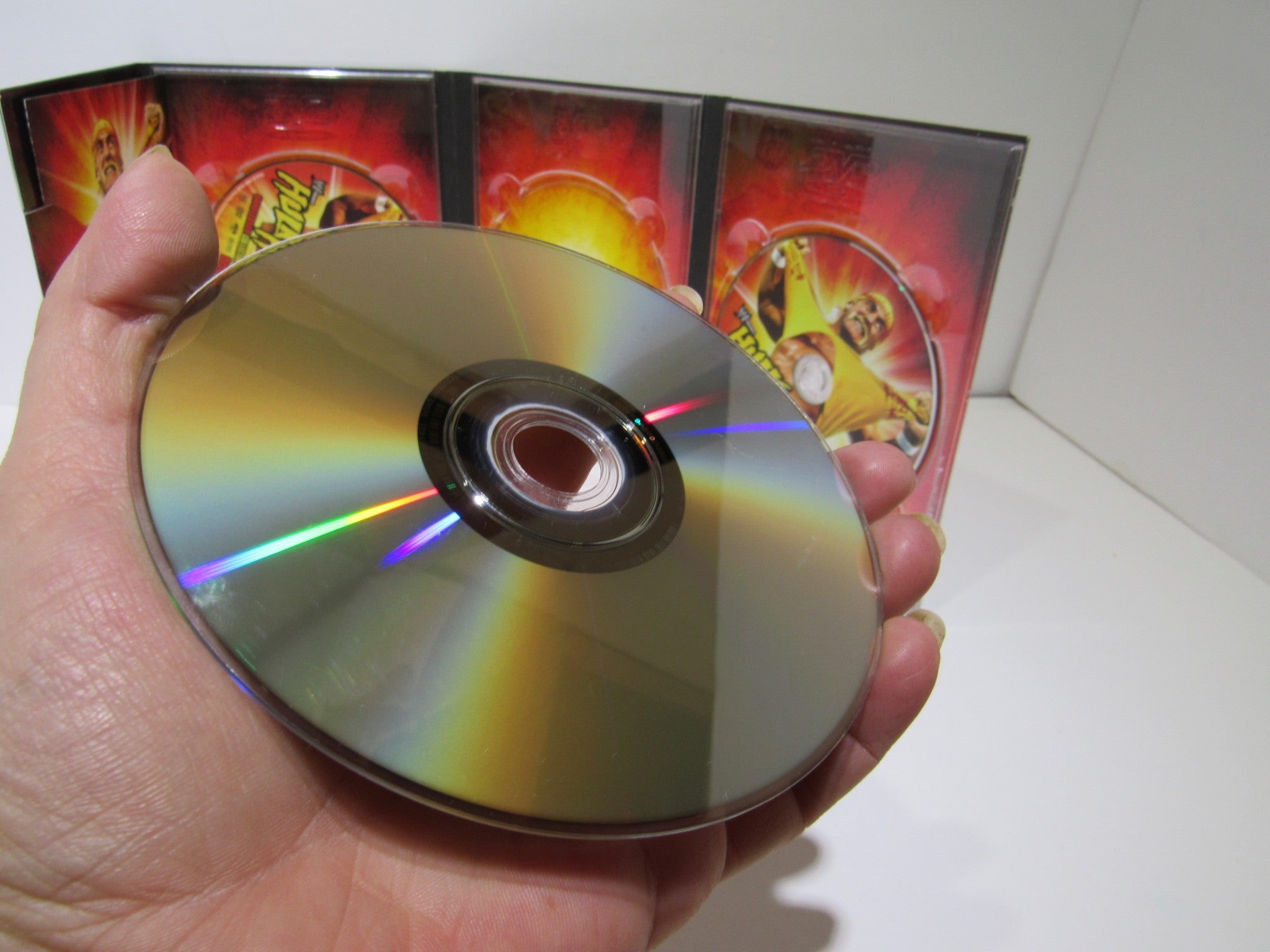 Close-up of the DVD disc from WWE: Hulk Hogan's Unreleased Collector's Series (2009), showcasing the reflective surface and colorful design.