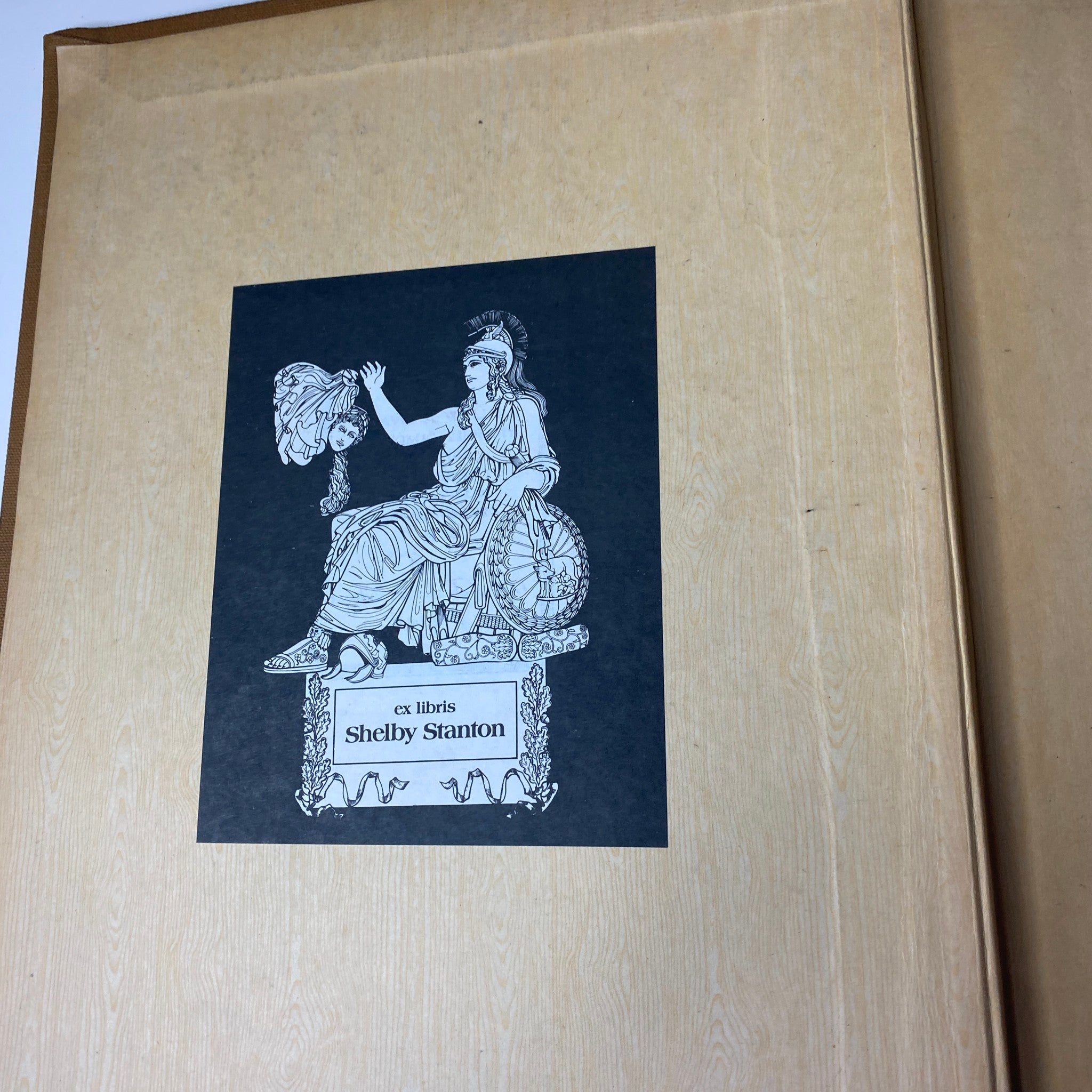 Ex libris bookplate featuring a seated figure in classical attire, included in the Ladies' Home Journal Bound Magazine 1944 July - December.