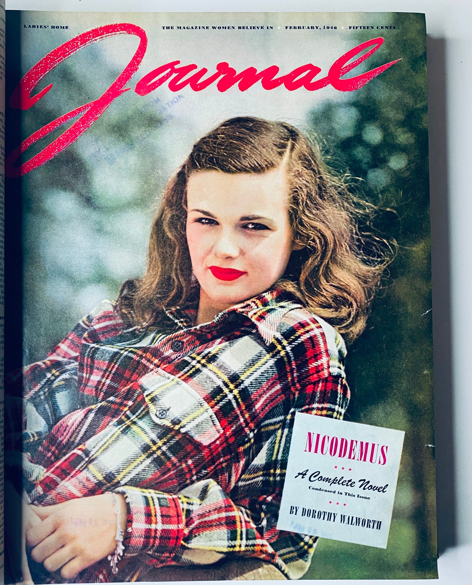 Cover of Ladies' Home Journal February 1946 featuring a young woman in a plaid shirt, representing the fashion and themes relevant to post-war America.