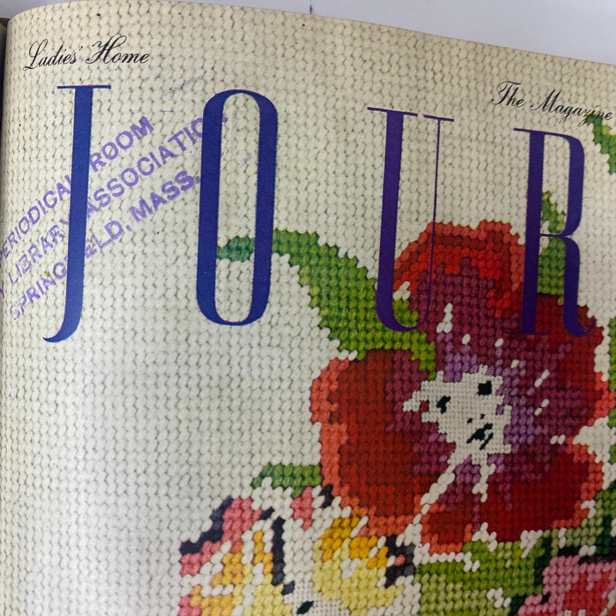 Detailed view of the Ladies' Home Journal magazine from April 1946 featuring colorful floral patterns, focusing on the intricate design elements of vintage magazine covers.