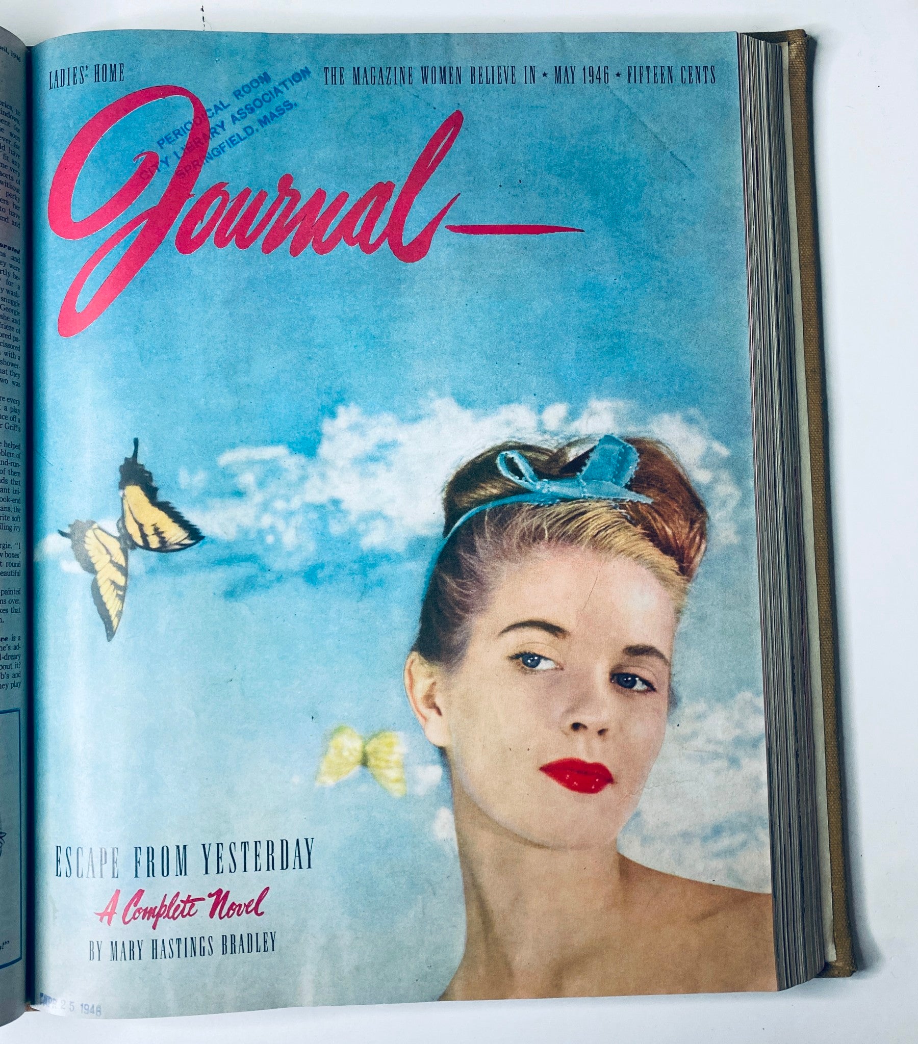 Cover image of the Ladies' Home Journal magazine from May 1946 showcasing a stylish woman with a blue headband, butterflies in flight, illustrating post-war fashion and lifestyle themes.