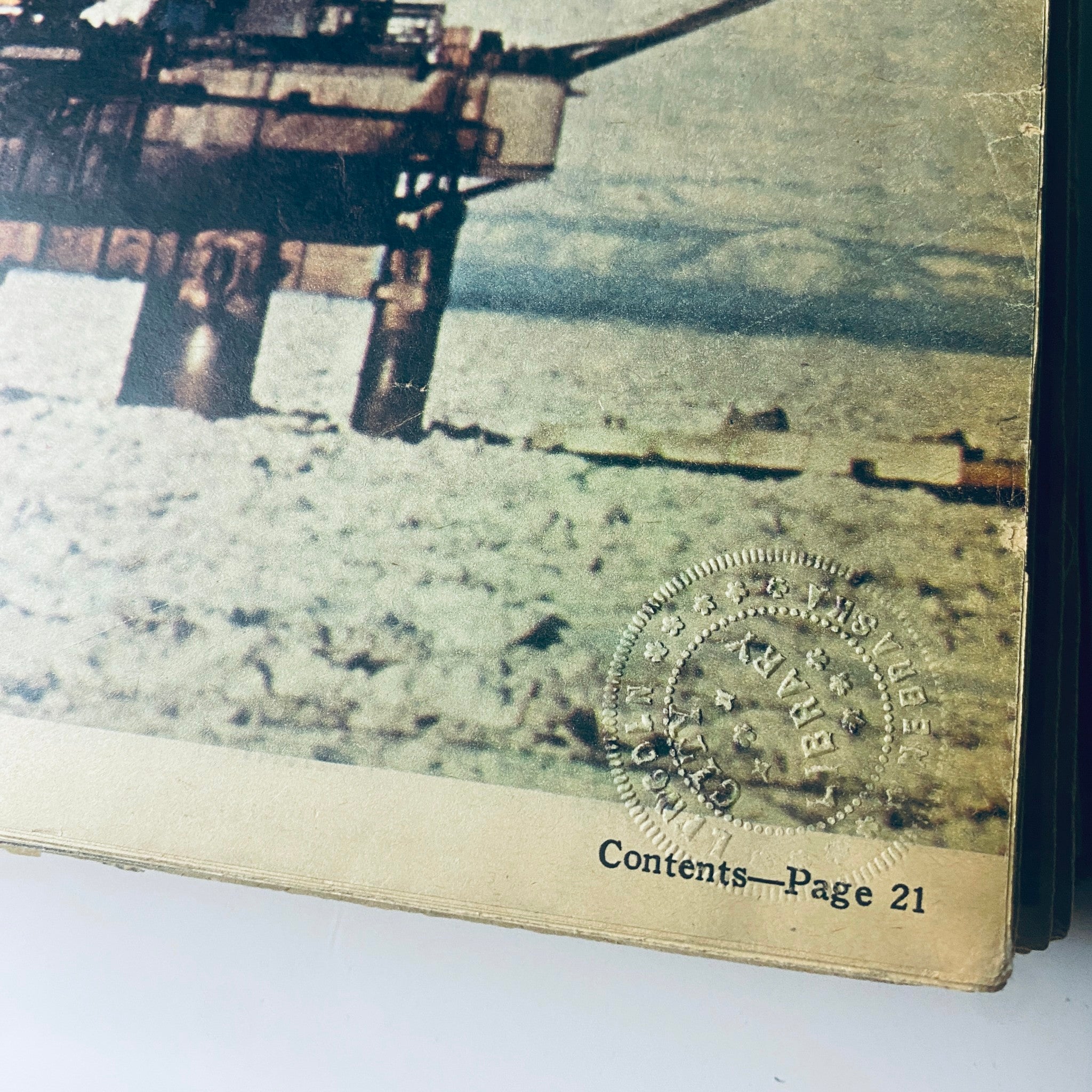 Close-up of the cover of The New York Times Library Edition Bound Magazine March - April 1970, highlighting the oil rig image and library stamp.