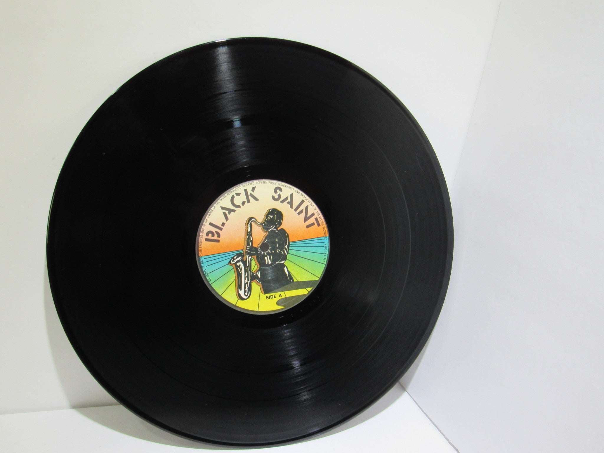 Vinyl record label of Sun Ra Arkestra: Reflections In Blue Black Saint BSR 0101 LP featuring the Black Saint logo and artwork.