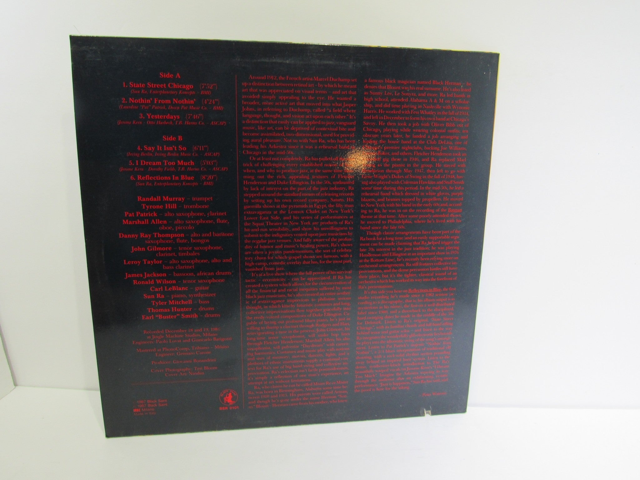 Back cover of the album 'Sun Ra Arkestra: Reflections In Blue Black Saint BSR 0101', featuring track listings and credits.