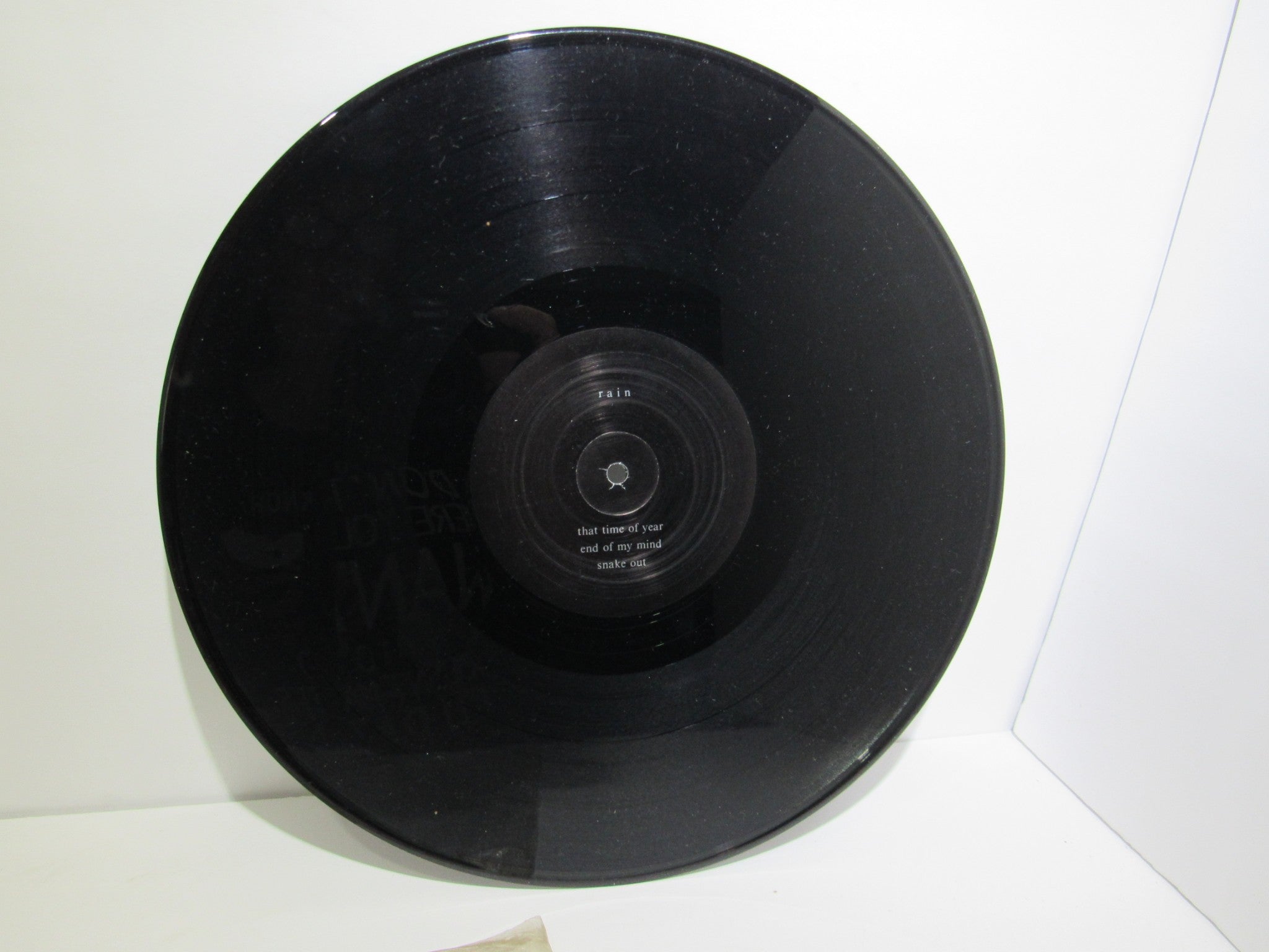 Close-up view of the vinyl record from Rain La Vache Qui Rit Peterbilt Records Peterbilt 3 1990 Rock LP, showing surface details.