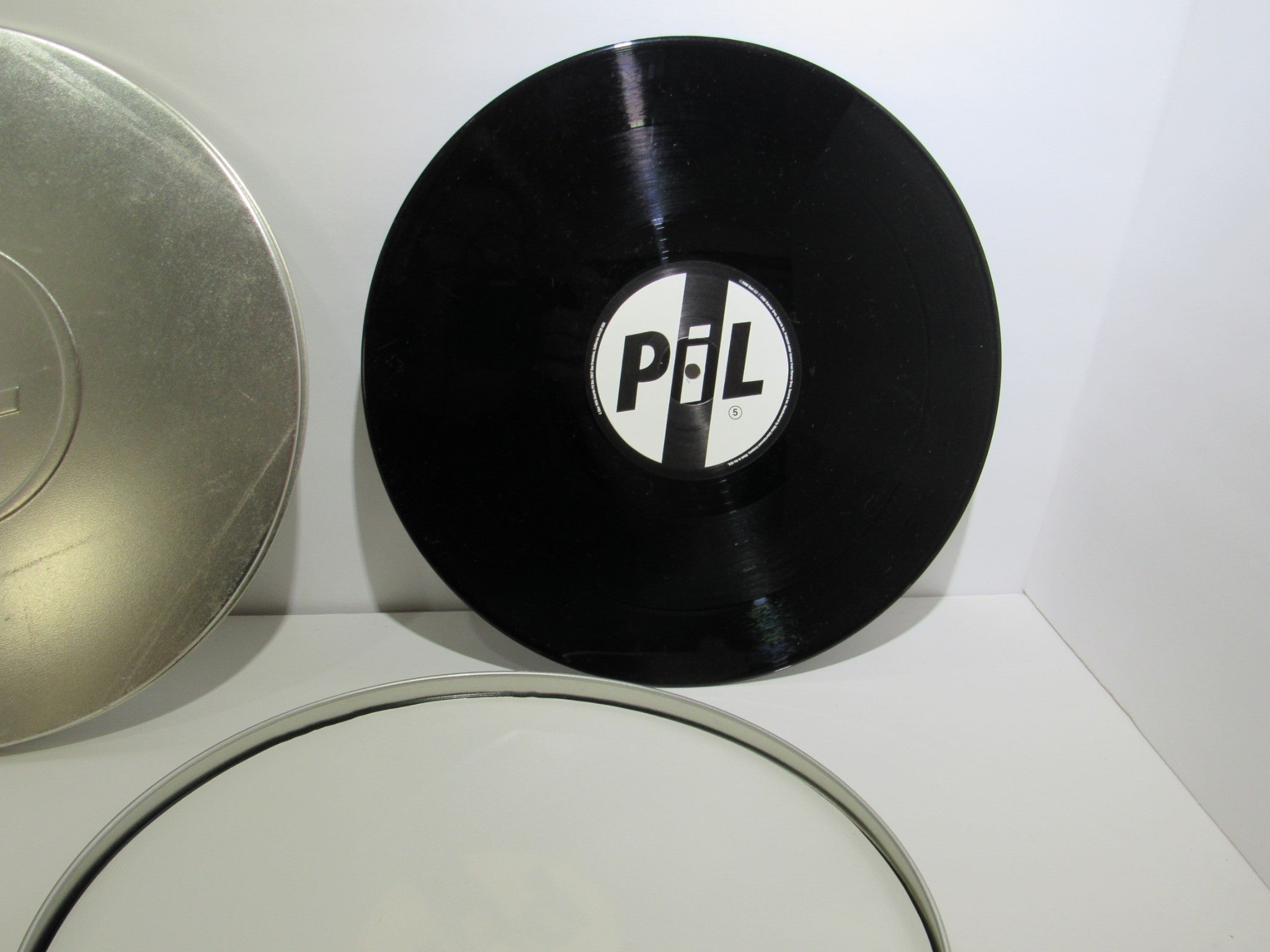 Public Image Limited Metal Box 4 Men With Beards ‎– 4M 500 3 x 12" Vinyl LP displayed with its black vinyl record and label.