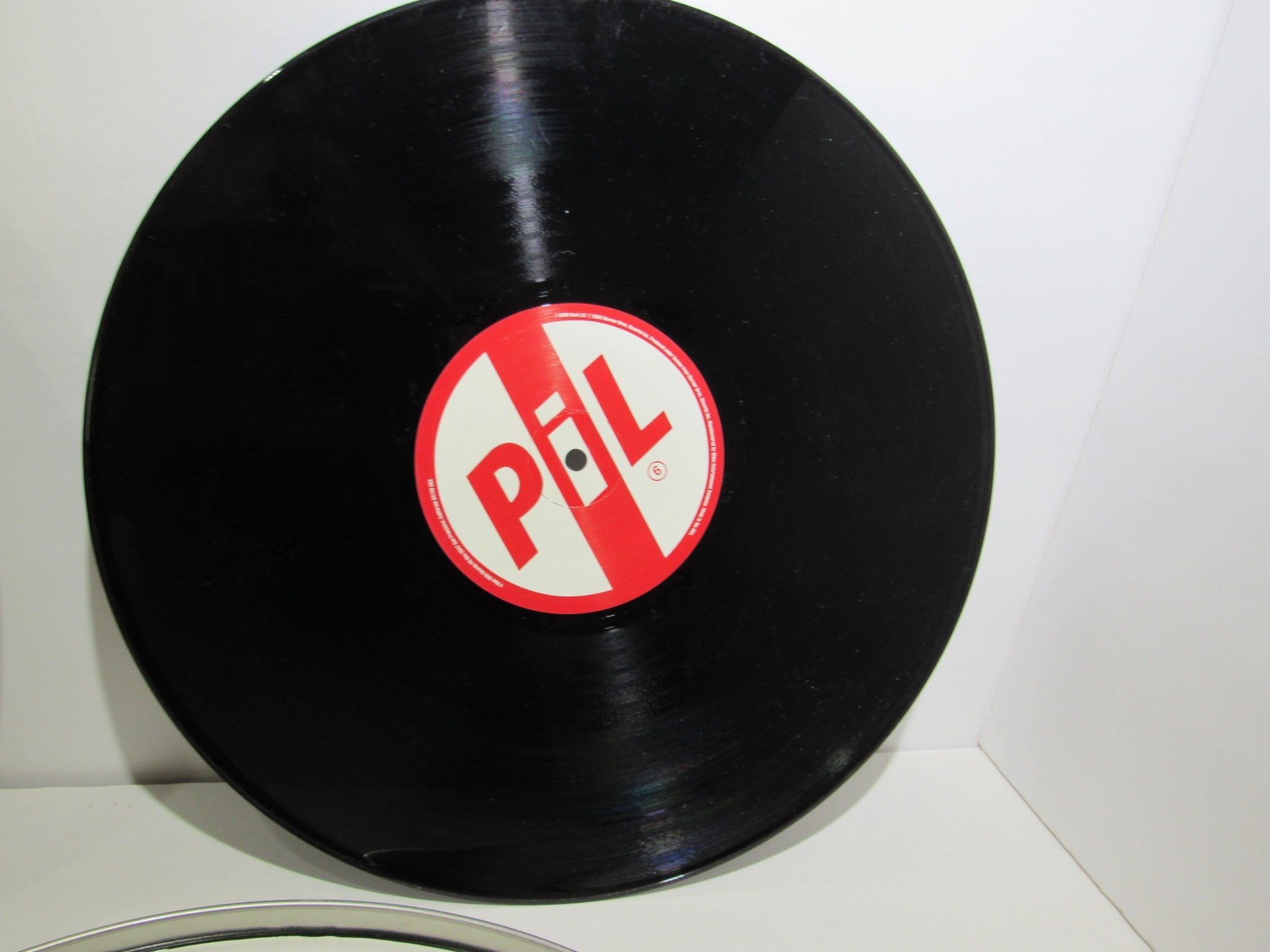 Public Image Limited Metal Box 4 Men With Beards ‎– 4M 500 3 x 12" Vinyl LP showing the red and white label of the record.