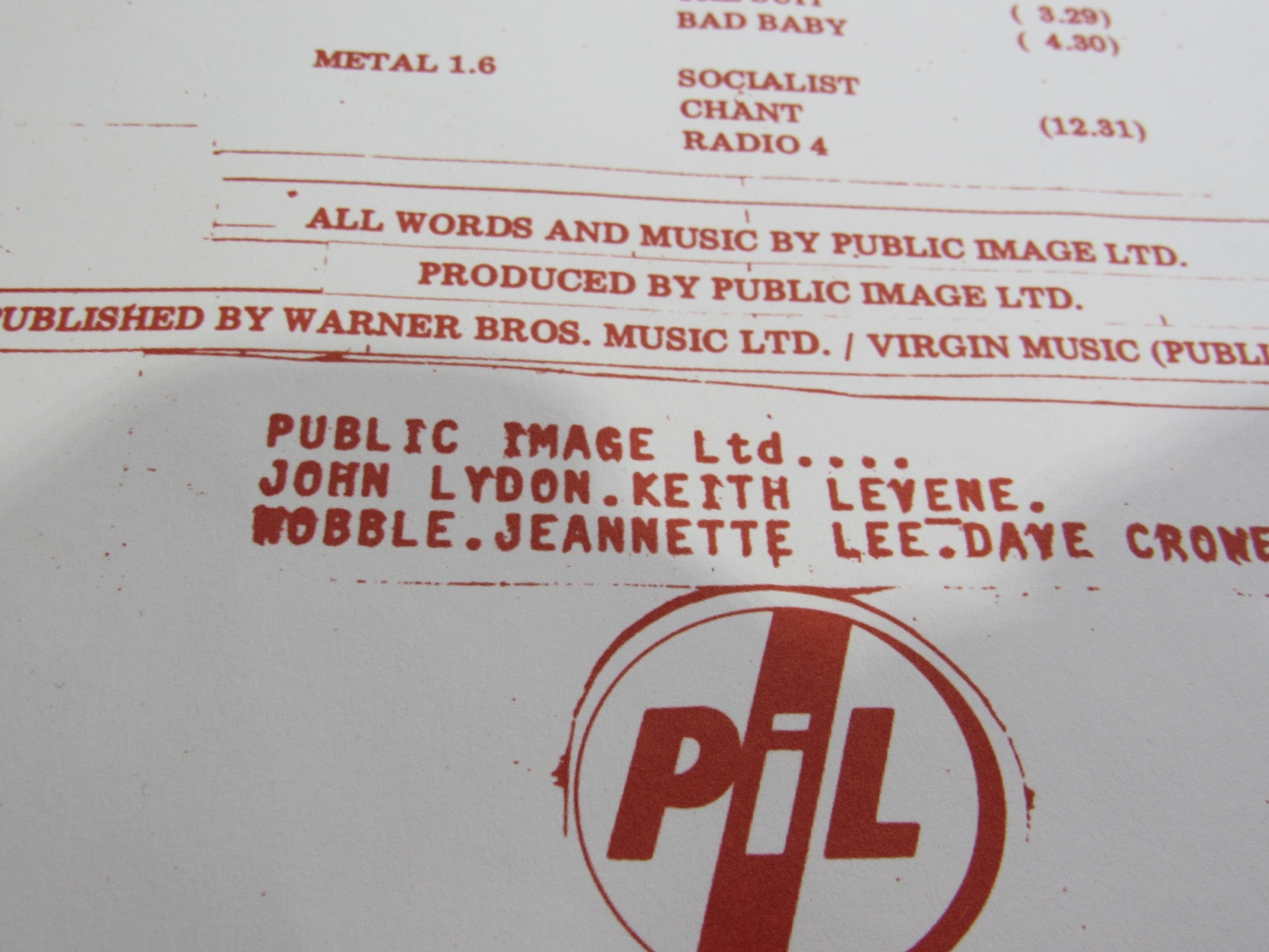 Detailed view of the inside sleeve of Public Image Limited Metal Box 4 Men With Beards – 4M 500, listing band members John Lydon, Keith Levene, Wobble, Jeannette Lee, and Dave Crone.
