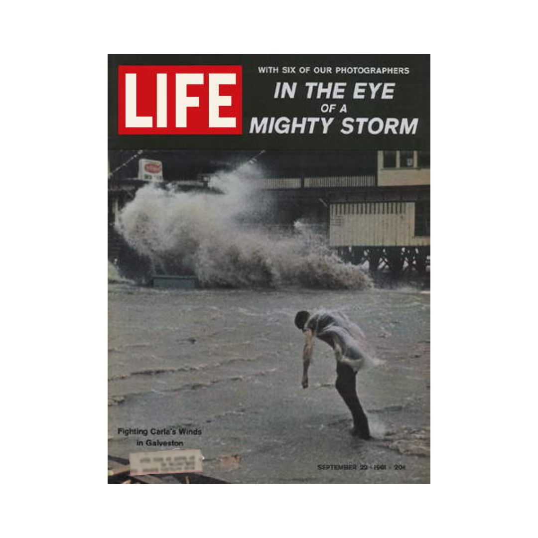 Life Magazine September 22, 1961 cover featuring Hurricane Carla with a man bracing against strong winds in Galveston. This iconic image captures the storm's impact highlighted in the magazine's feature.