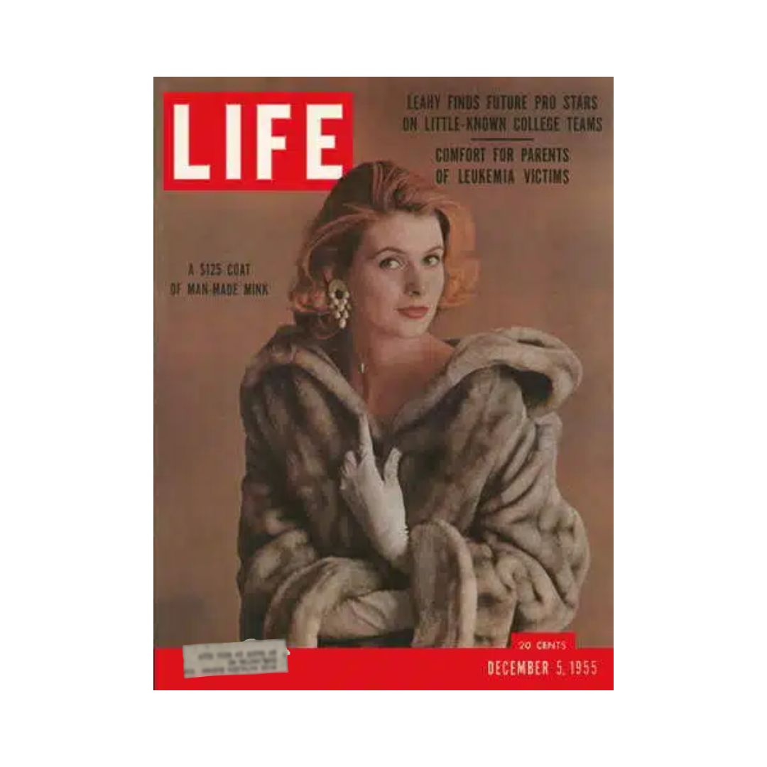 Cover of the VTG Life Magazine December 5, 1955 featuring a woman in a luxurious coat made of man-made mink, highlighting fashion advancements of the era. The magazine showcases significant cultural moments from the 1950s.