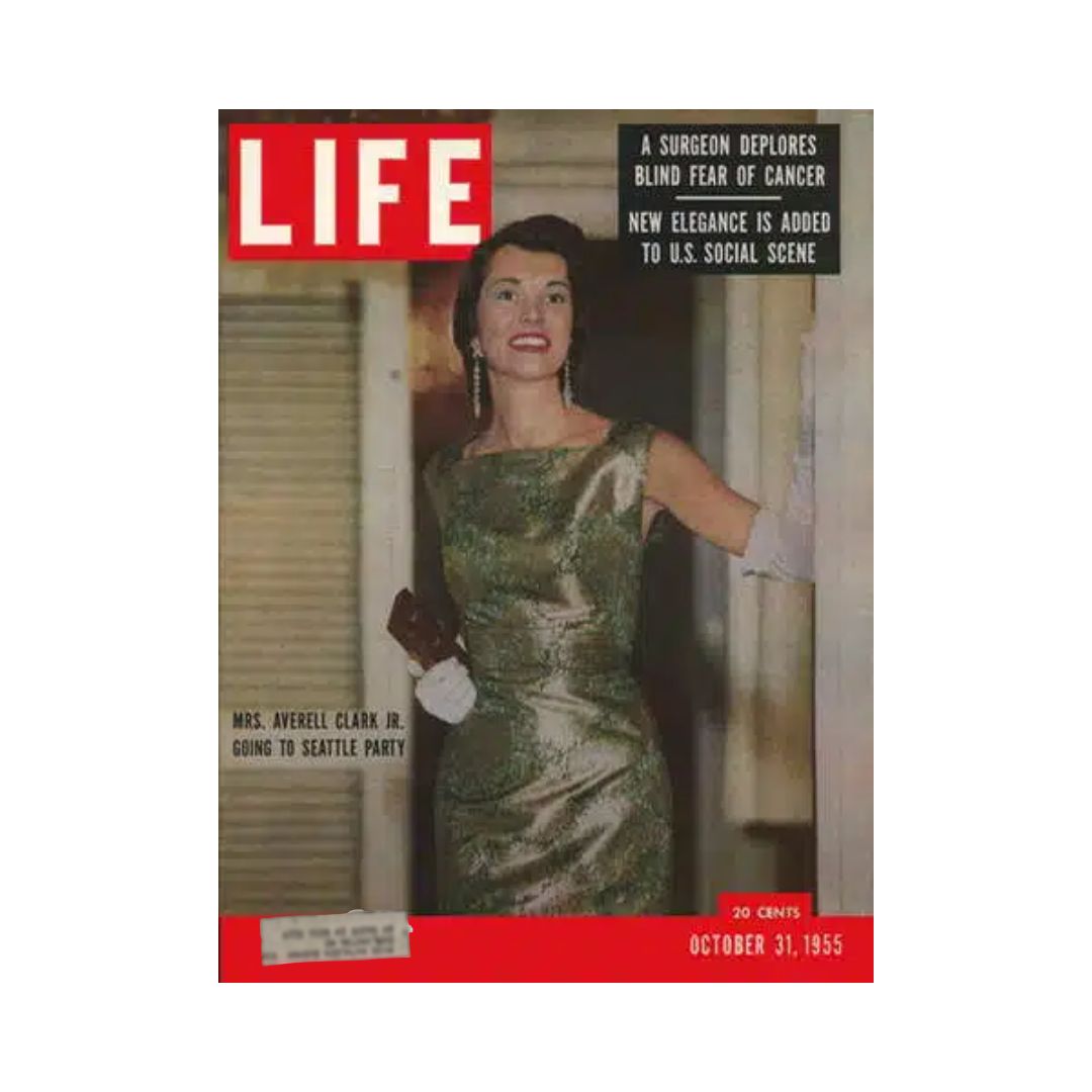 Life Magazine cover from October 31, 1955 featuring Mrs. Averell Clark, Jr. dressed elegantly in a green gown, highlighted by a glamorous hairstyle and accessories. The cover also includes headlines about cancer awareness and new elegance in American social life.