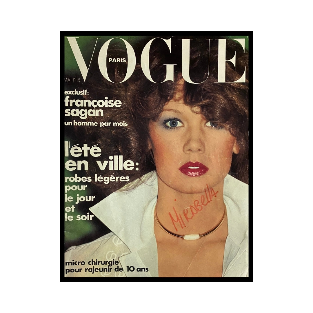 Vogue Paris Magazine May 1975 featuring Marisa Berenson on the cover, showcasing 1970s fashion with striking makeup and hairstyle.