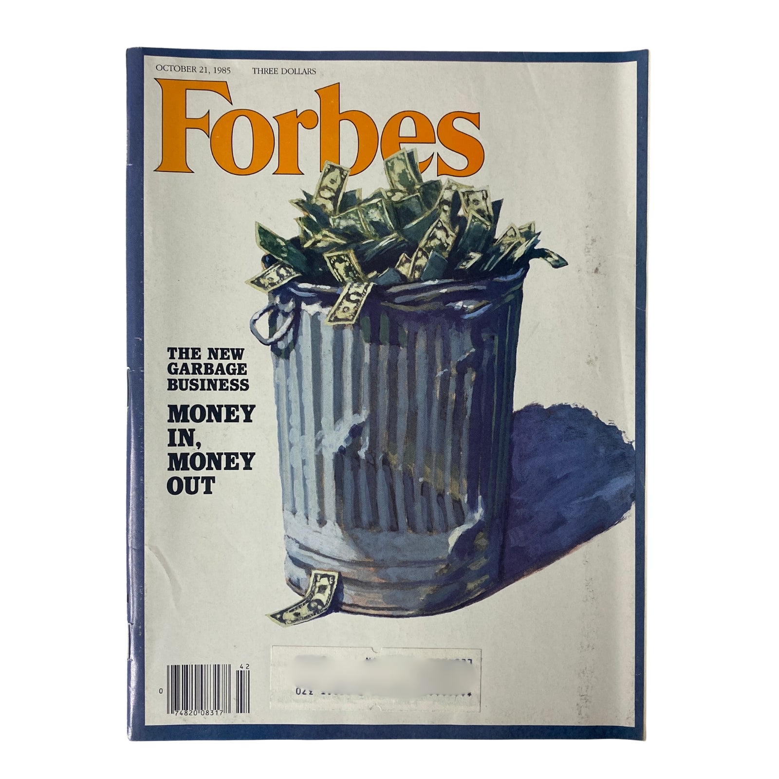 Forbes Magazine cover from October 21, 1985, featuring a trash can overflowing with dollar bills, highlighting the theme 'The New Garbage Business: Money In, Money Out.'